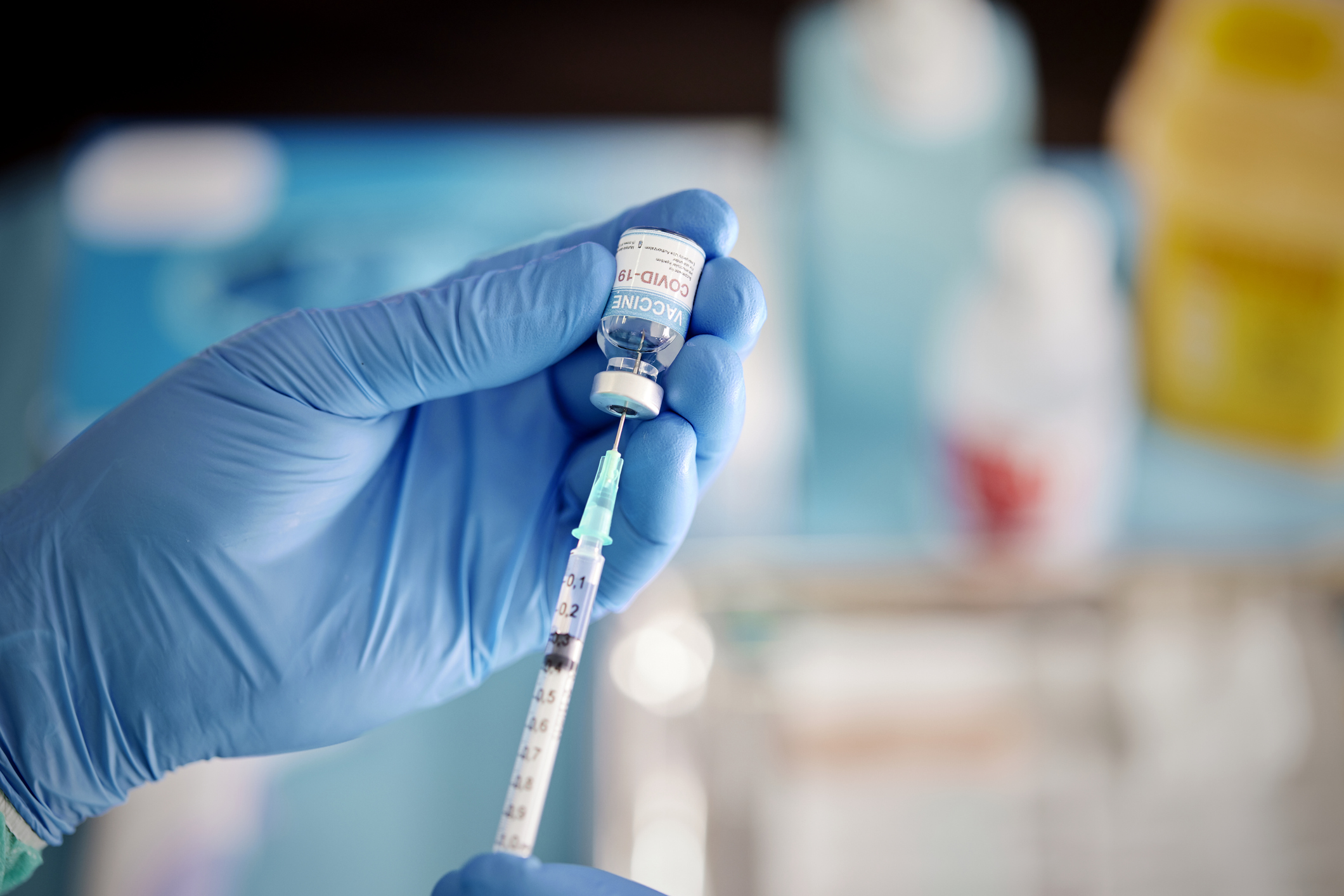 A Healthcare Worker Prepares a Dose of COVID-19 Vaccine.