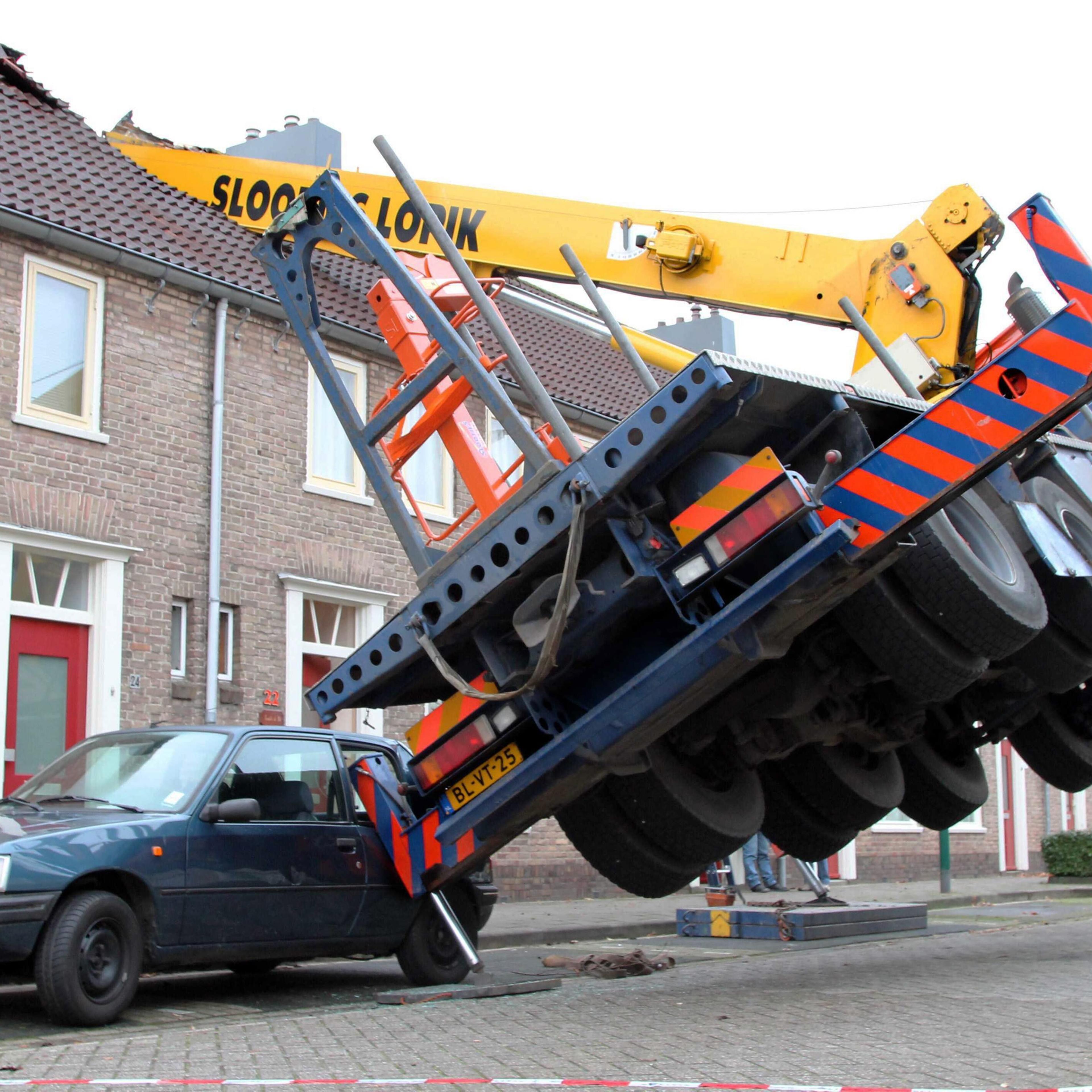 Crane topples on to house during dramatic proposal