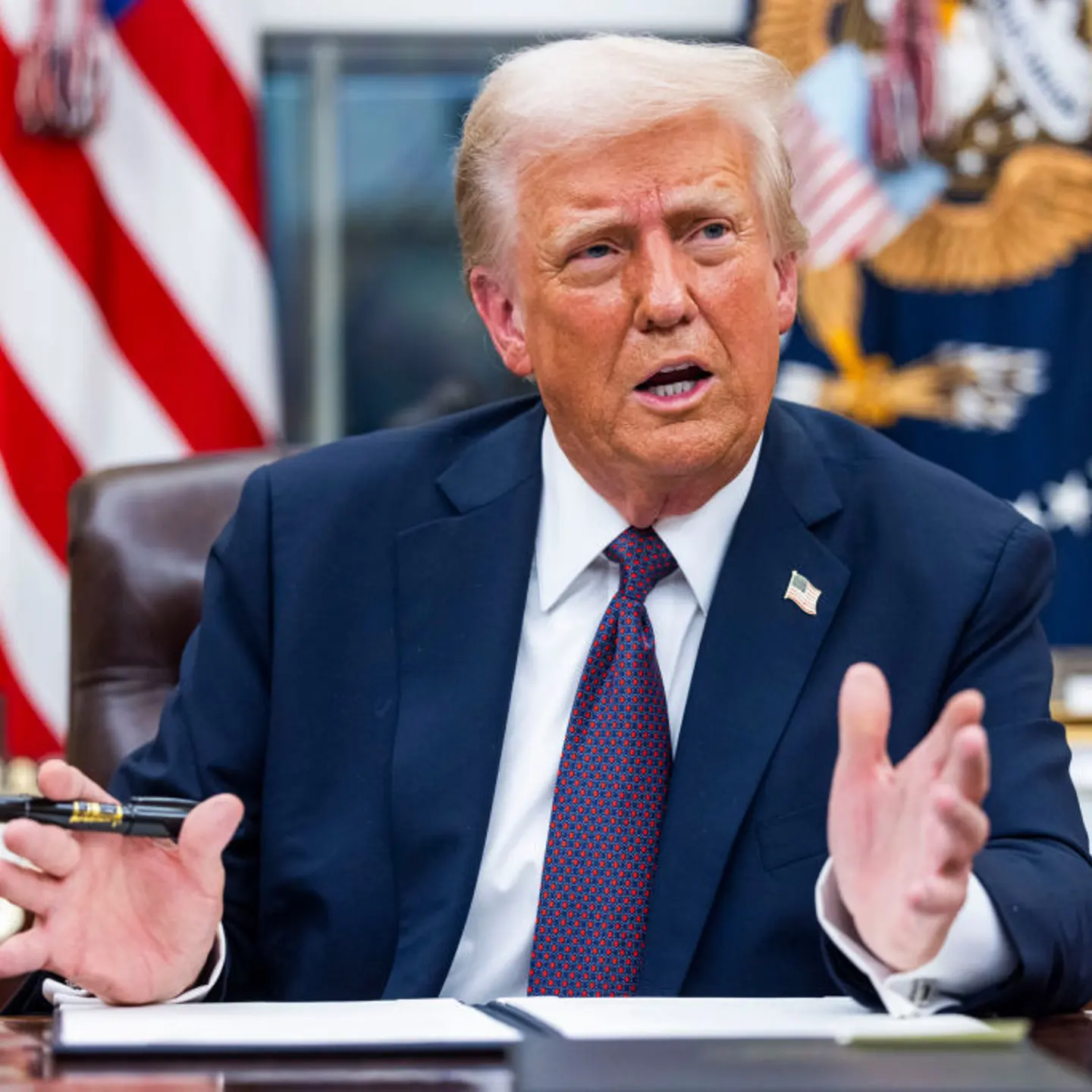President Donald Trump signs executive orders in the Oval Office of the White House on Jan. 20, 2025.
