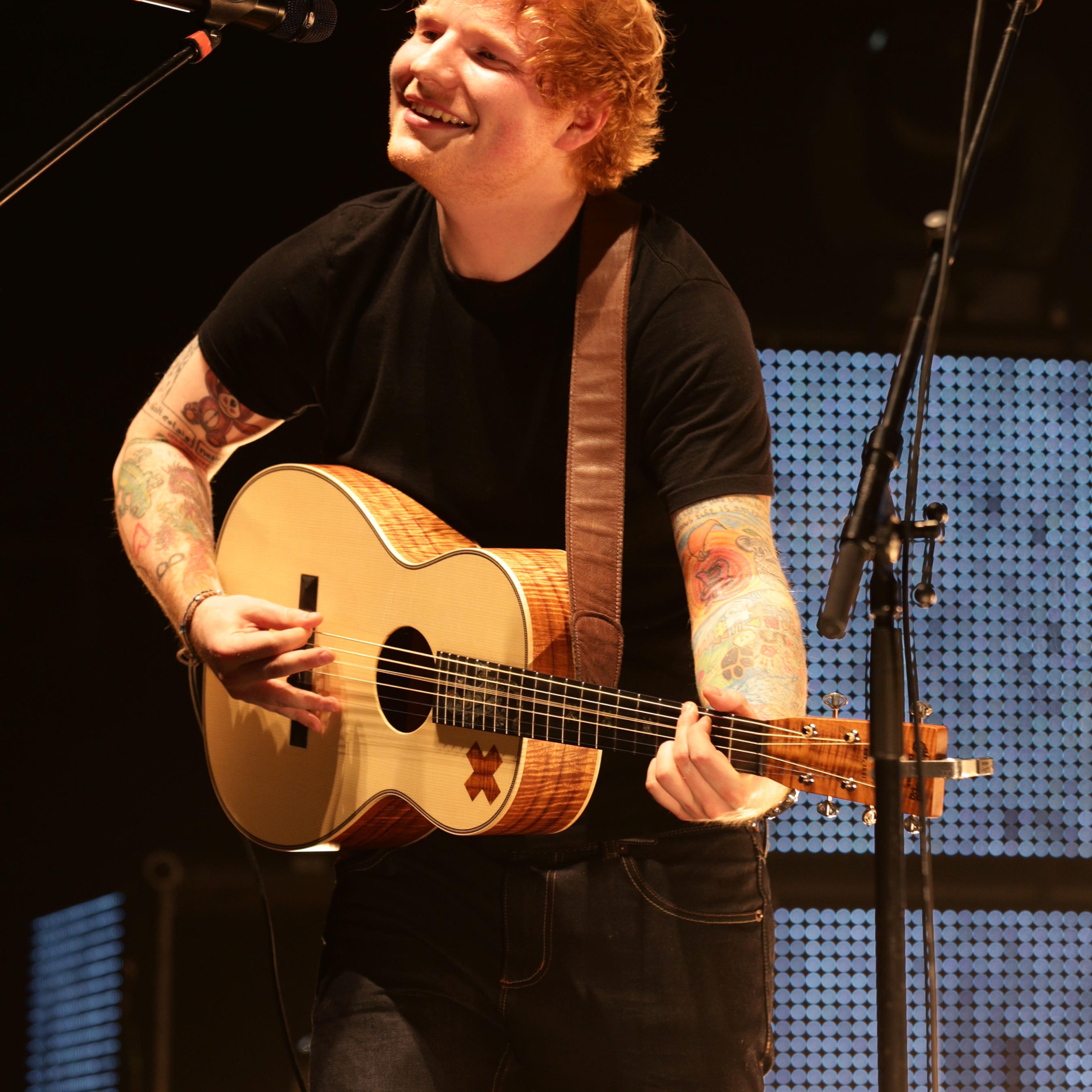 Ed Sheeran performing on stage in London. (Yui Mok—PA Wire/AP)