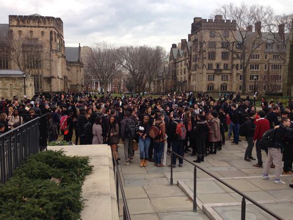 Heidi Knoblauch, a Yale historian, posted this picture saying, "I'm sure lots of other people took better pictures than this, but here is a glimpse of #HandsUpWalkout @Yale" http://t.co/76kUiy47Se