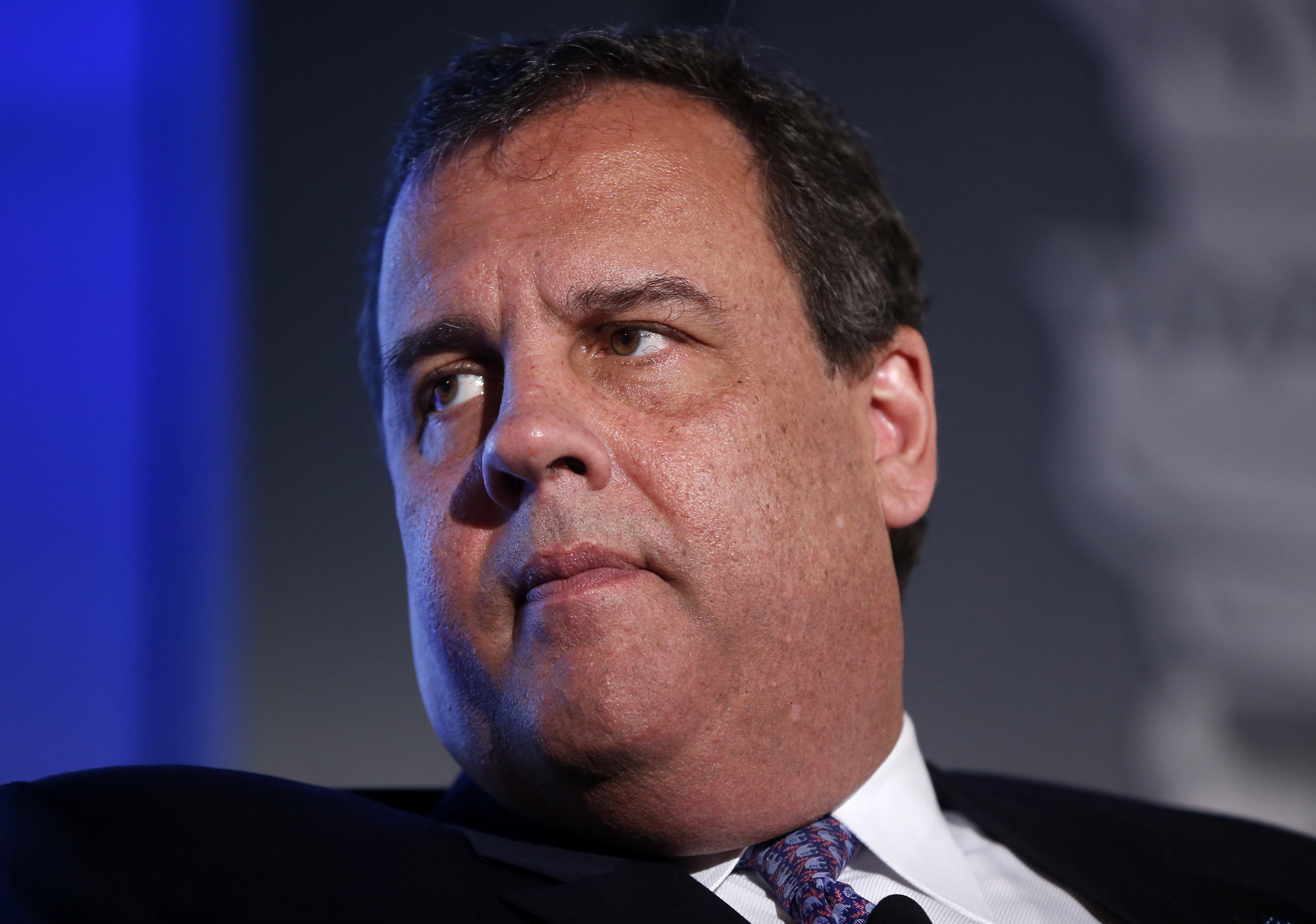 New Jersey Gov. Chris Christie listens to a question from Bob Schieffer of CBS News at the 2014 Fiscal Summit organized by the Peter G. Peterson Foundation in Washington, May 14, 2014.