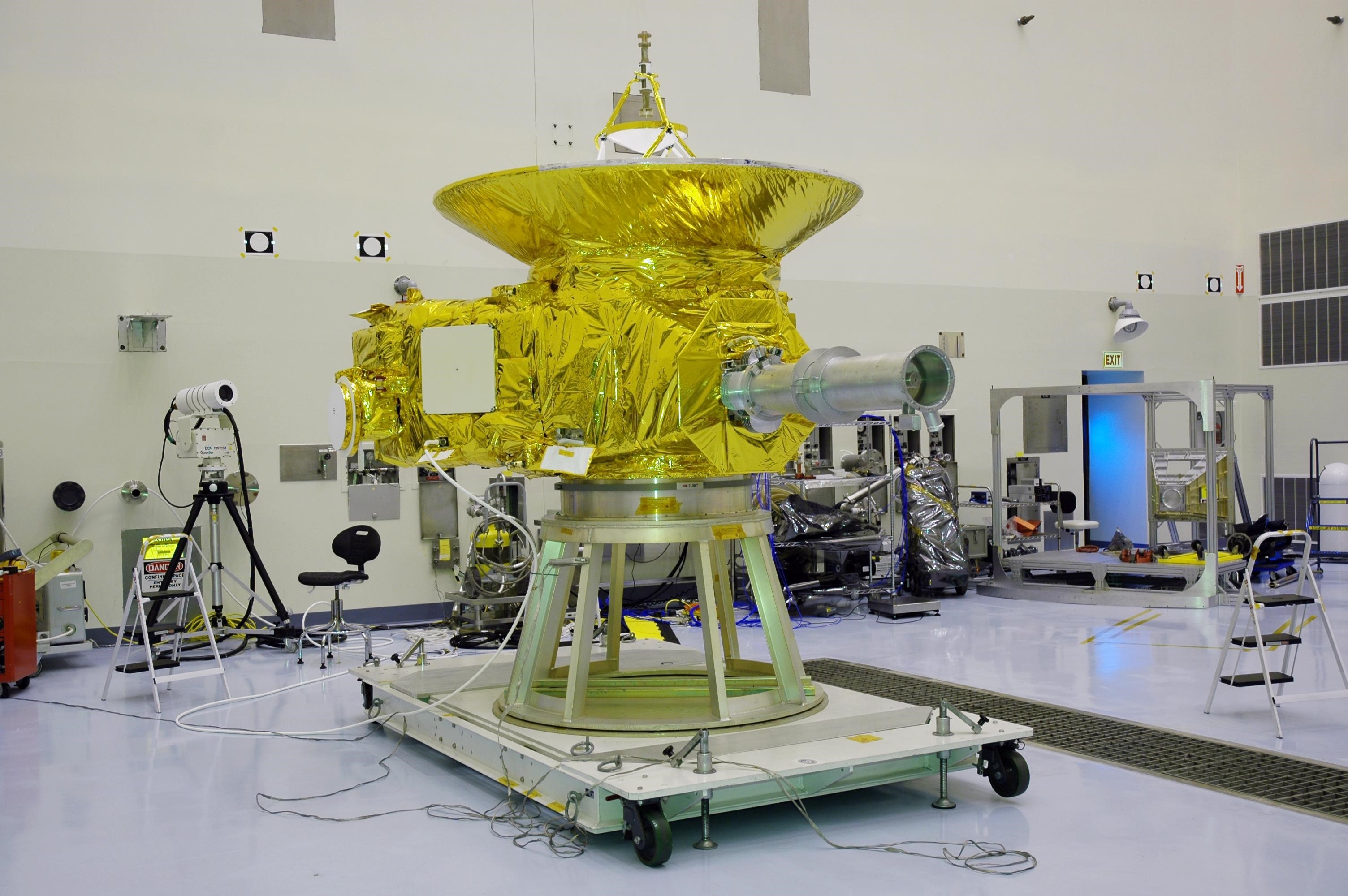 KENNEDY SPACE CENTER, FLA. - In NASA Kennedy Space Center’s Payload Hazardous Servicing Facility, the New Horizons spacecraft sits on a work stand prior to being moved to a spin table.  The spacecraft will undergo a spin test as part of prelaunch process