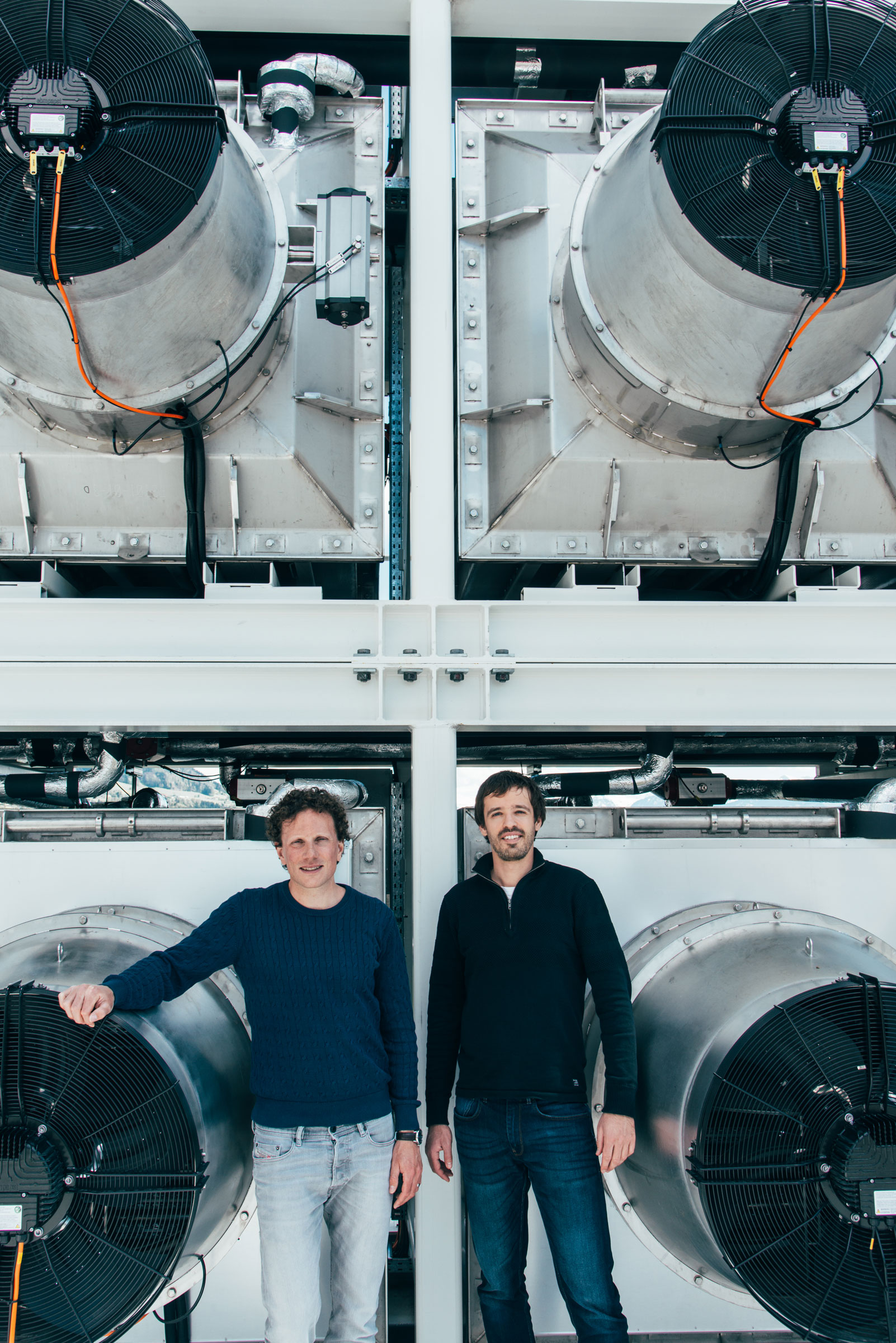 Climeworks founders Christoph Gebald and Jan Wurzbacher in front of a Climeworks plant in Switzerland