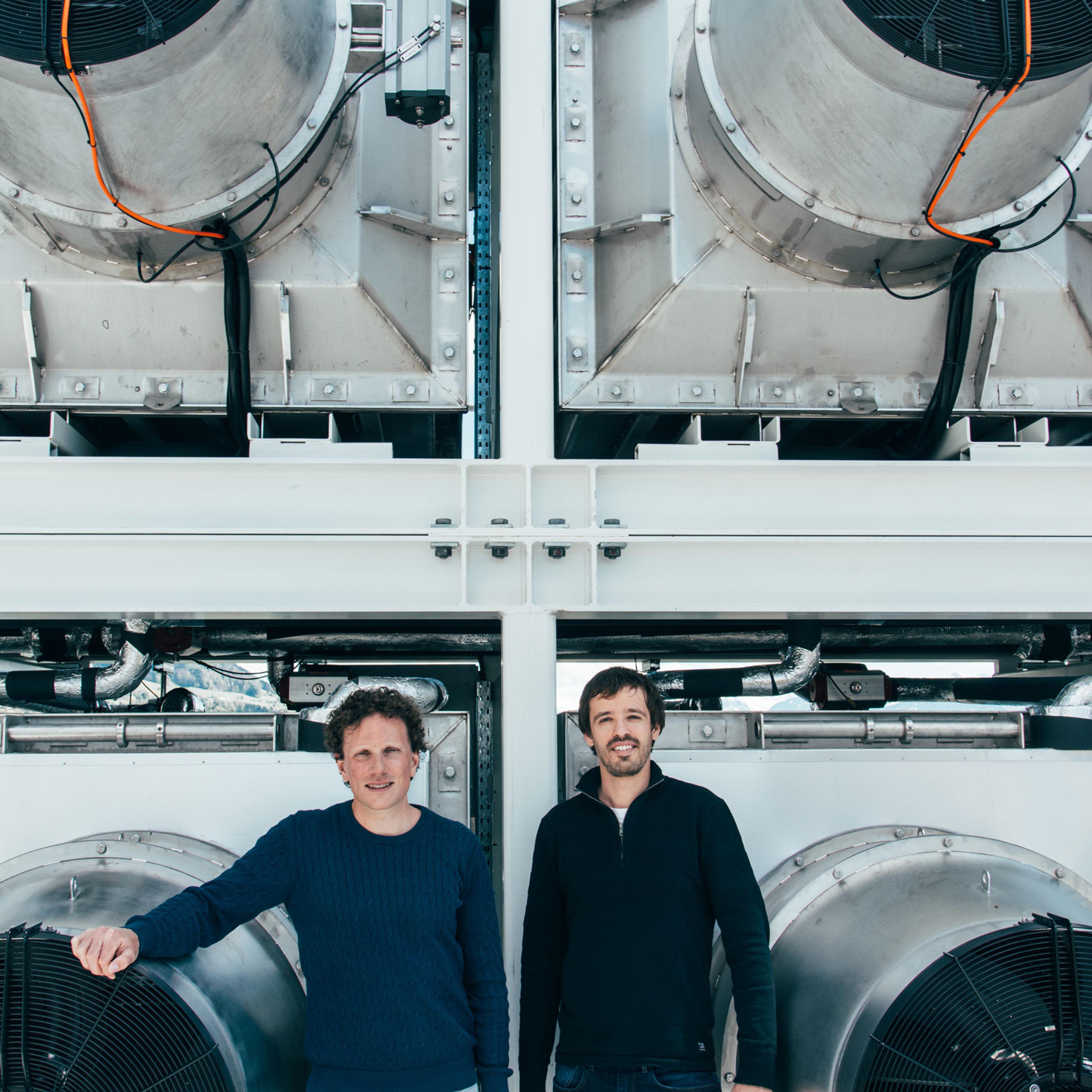 Climeworks founders Christoph Gebald and Jan Wurzbacher in front of a Climeworks plant in Switzerland