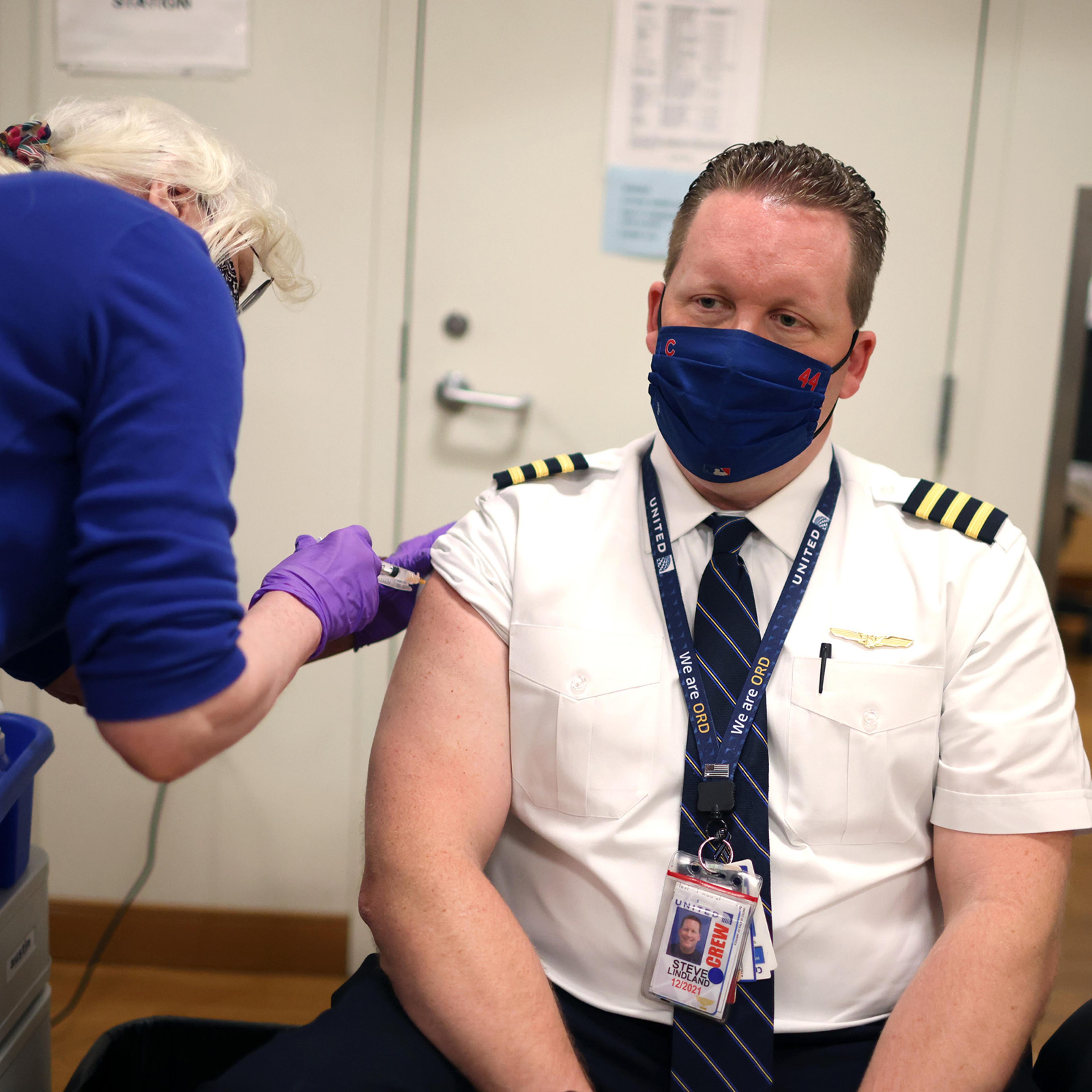 United Airlines Employees Receive COVID-19 Vaccination At O'Hare Airport
