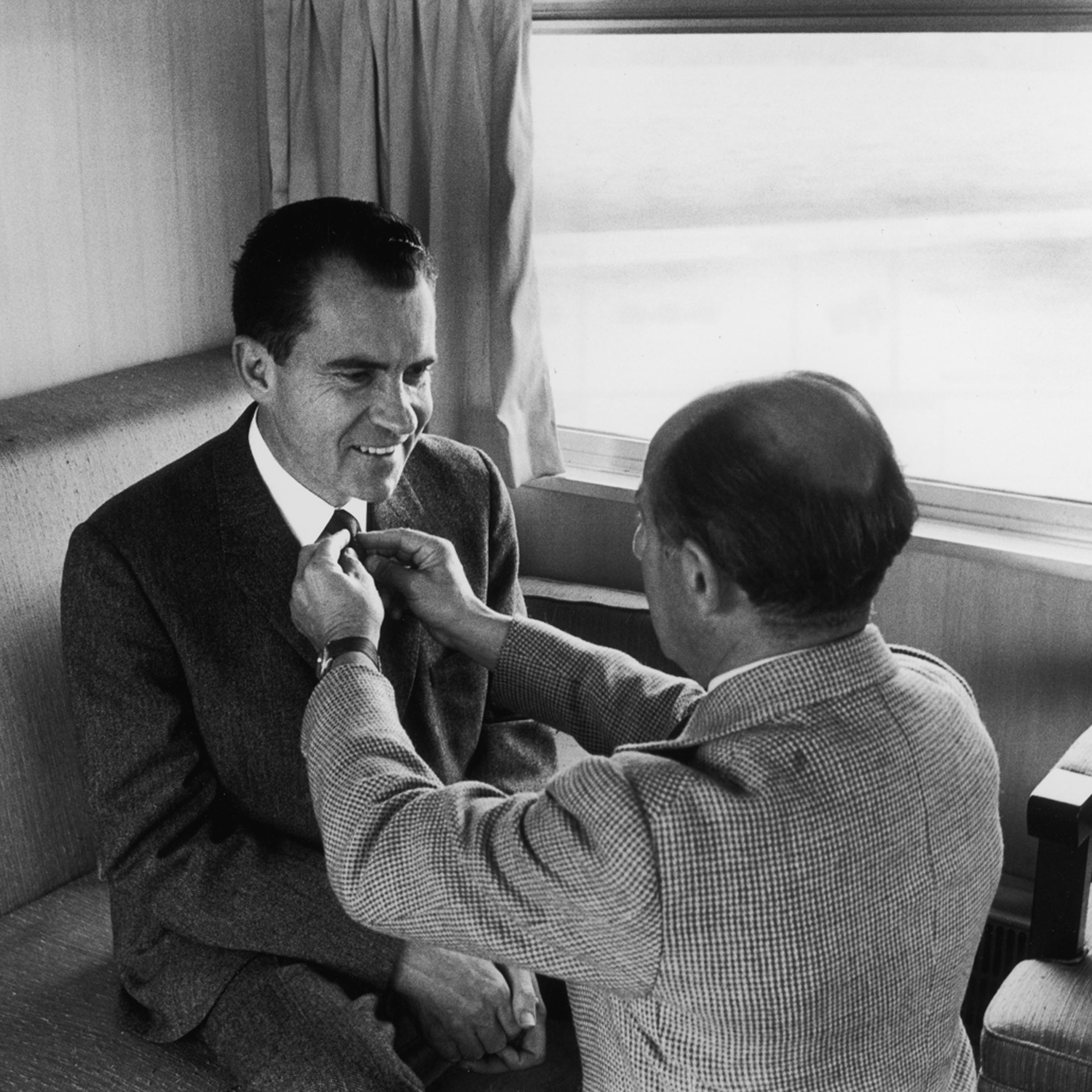 Photographer Alfred Eisenstaedt adjusts Richard Nixon's tie during the 1960 presidential campaign.