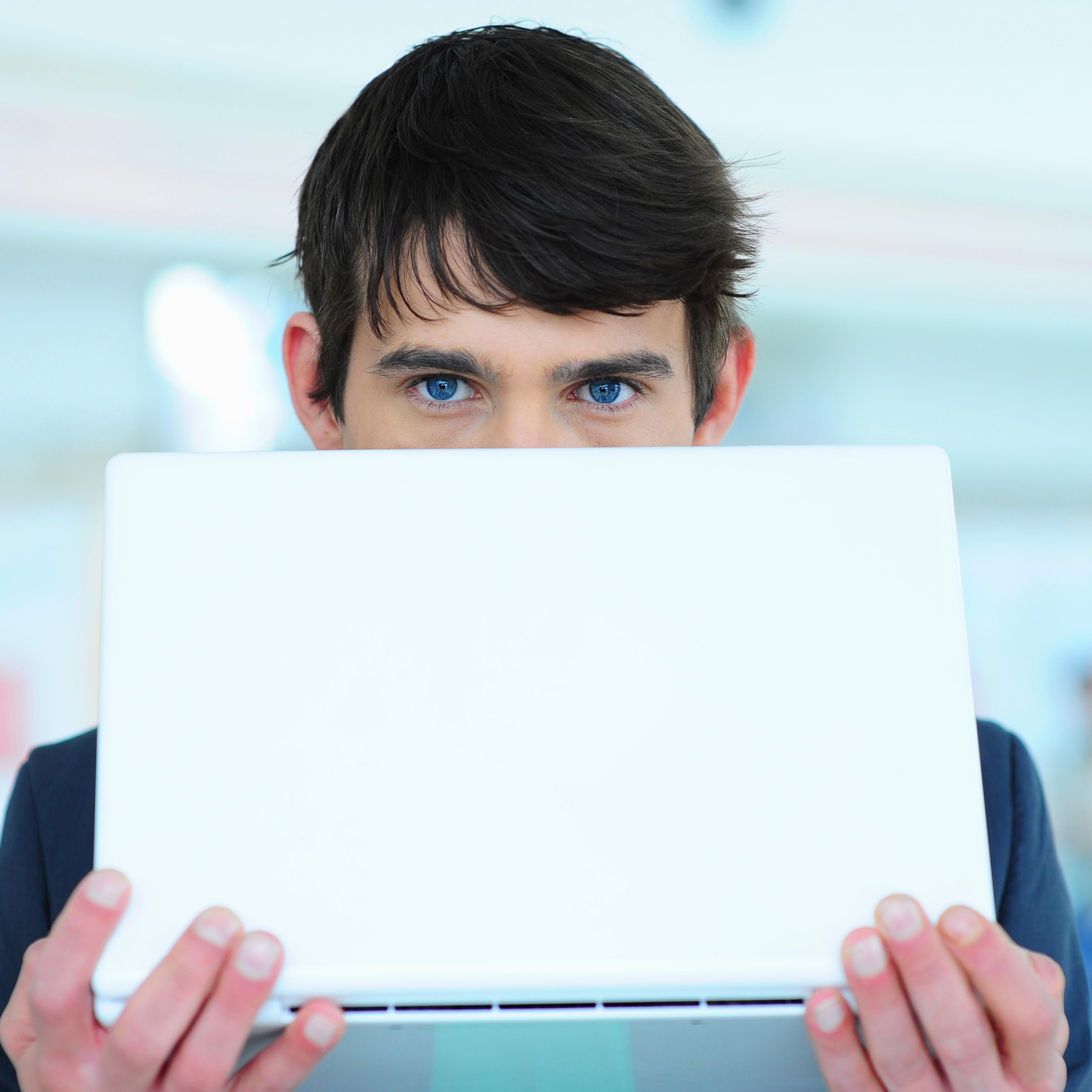 man-behind-laptop