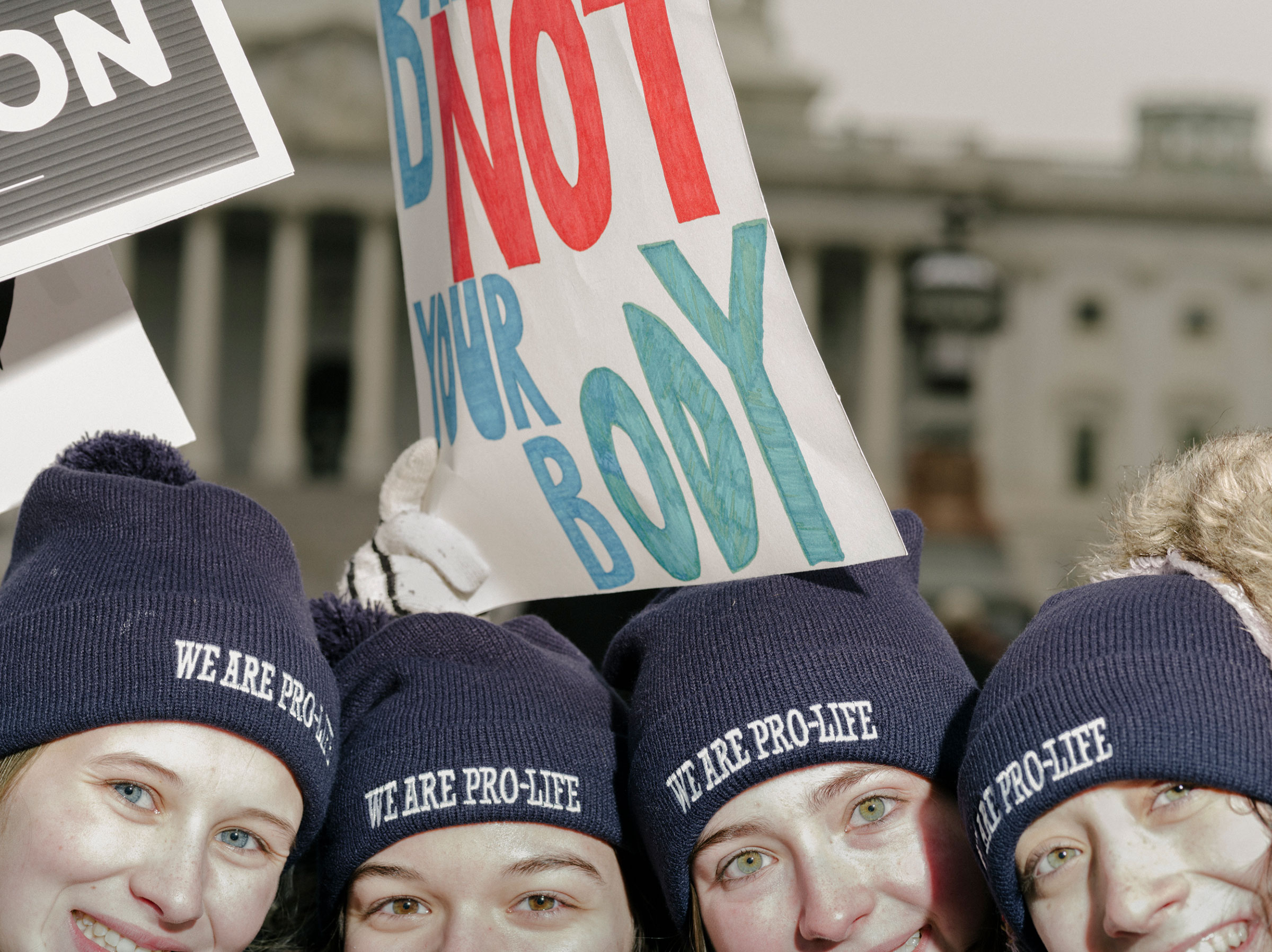 Attendees of the March for Life, held the day before the anniversary of the Supreme Court ruling of Roe v. Wade, stand in front of the Supreme Court building in Washington, on Jan. 21, 2022.