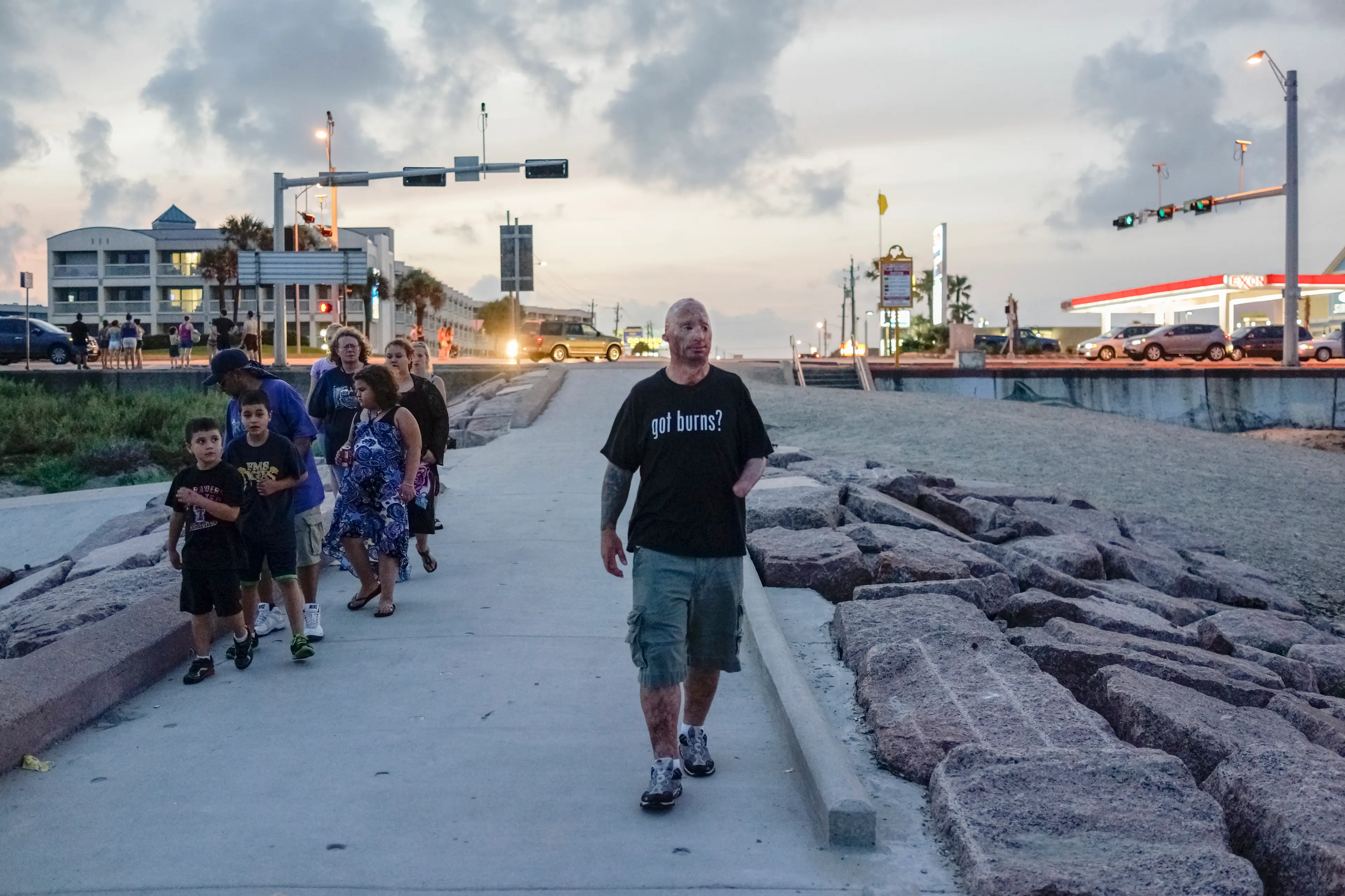 2013. Galveston, TX. USA. Bobby walks along the beach after visiting Grant, a 12-year old who was burned as a toddler. He was having a surgery the next day and Bobby went by his hotel to cheer him up. Bobby Henline, 41, veteran of four tours to Iraq and