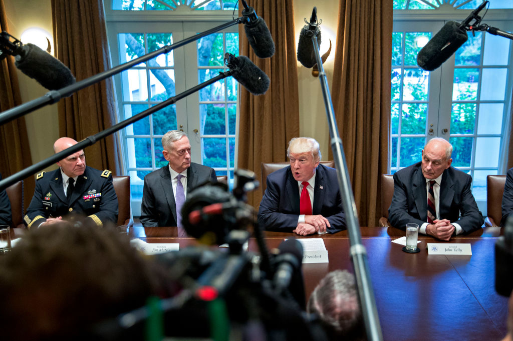 U.S. President Donald Trump (C), then national security advisor H.R. McMaster (L), Defense Secretary Jim Mattis (2nd L) and then White House chief of staff John Kelly (R) attend a briefing with senior military leaders in the Cabinet Room of the White Hou