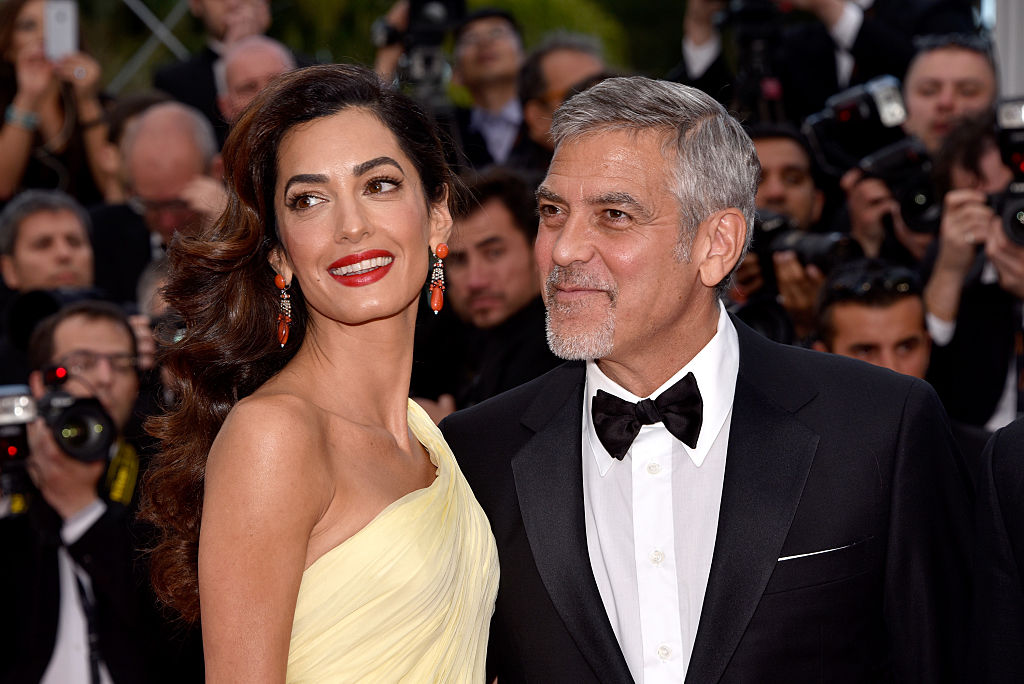 Actor George Clooney and his wife Amal Clooney attend the "Money Monster" premiere during the 69th annual Cannes Film Festival at the Palais des Festivals on May 12, 2016 in Cannes, France.
