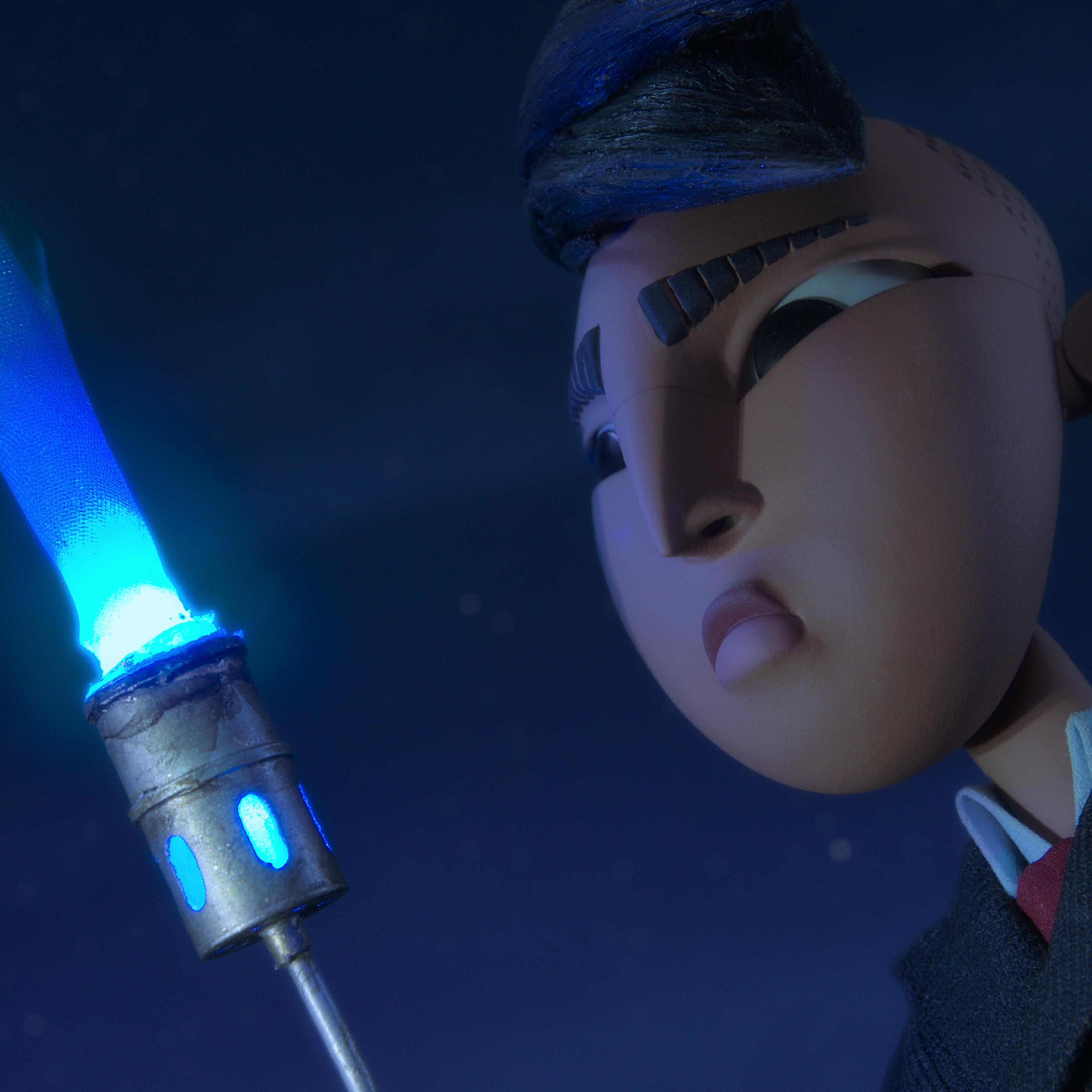 Raul stares into the blue flames of a torch