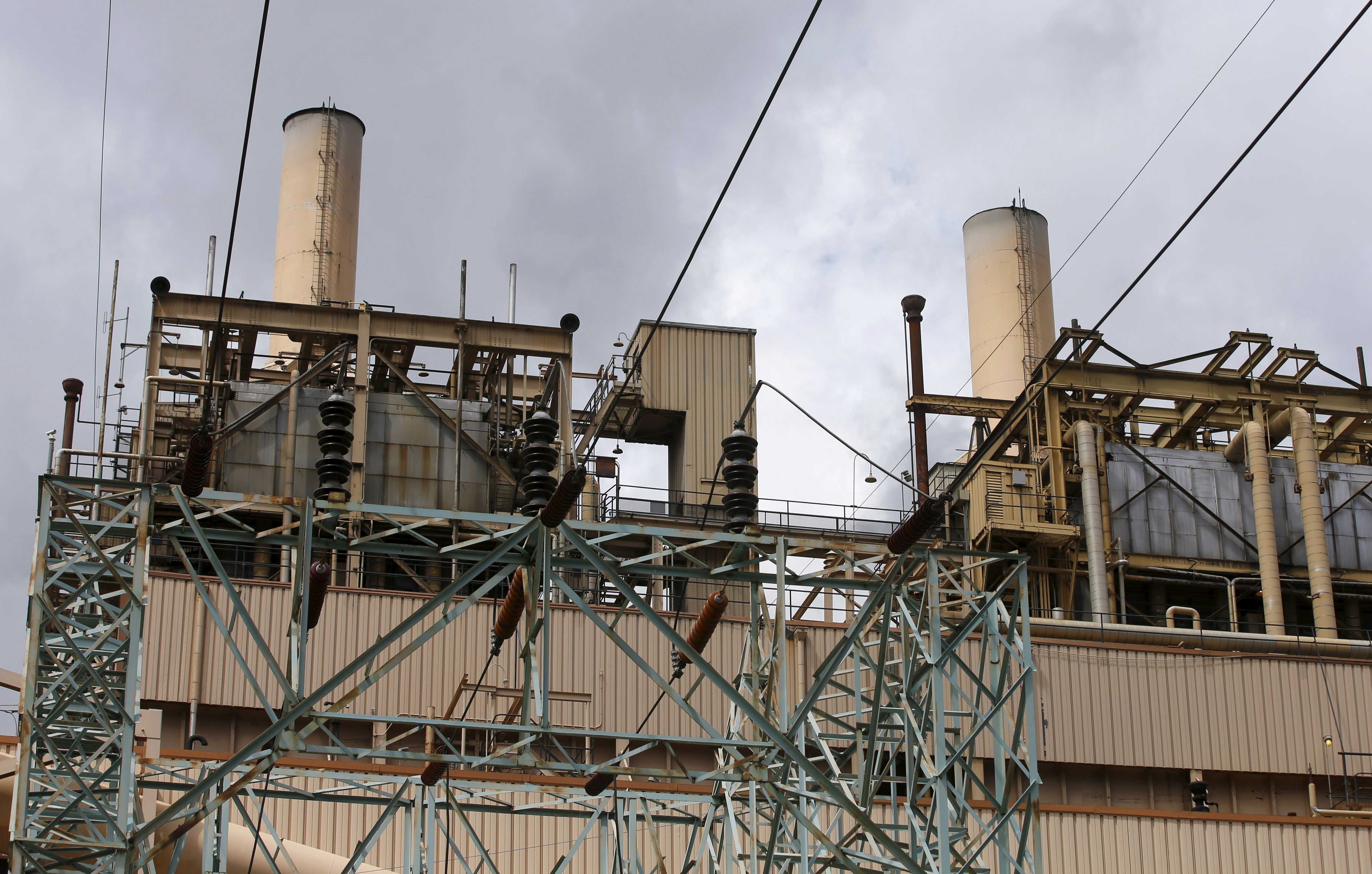 Electric power lines lead into the coal-fired Castle Gate Power Plant that is sitting idle and is no longer producing electricity outside Helper, Utah, Aug. 3, 2015. The plant was closed in the Spring of 2015 in anticipation of new EPA regulations.