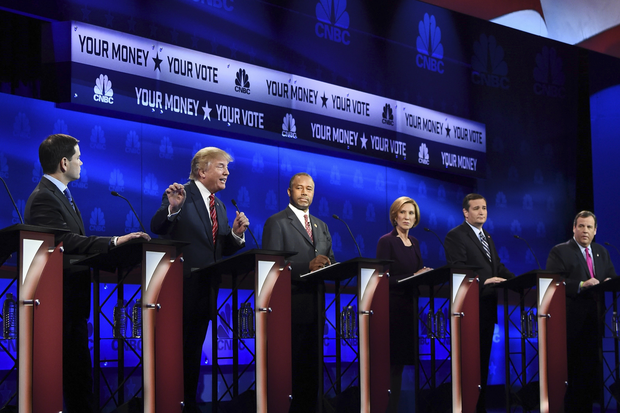 Republican Presidential hopeful Donald Trump (2L) speaks as Marco Rubio (L), Ben Carson (C), Carly Fiorina (2R), and Ted Cruz look on during the CNBC Republican Presidential Debate, October 28, 2015 at the Coors Event Center at the University of Colorado