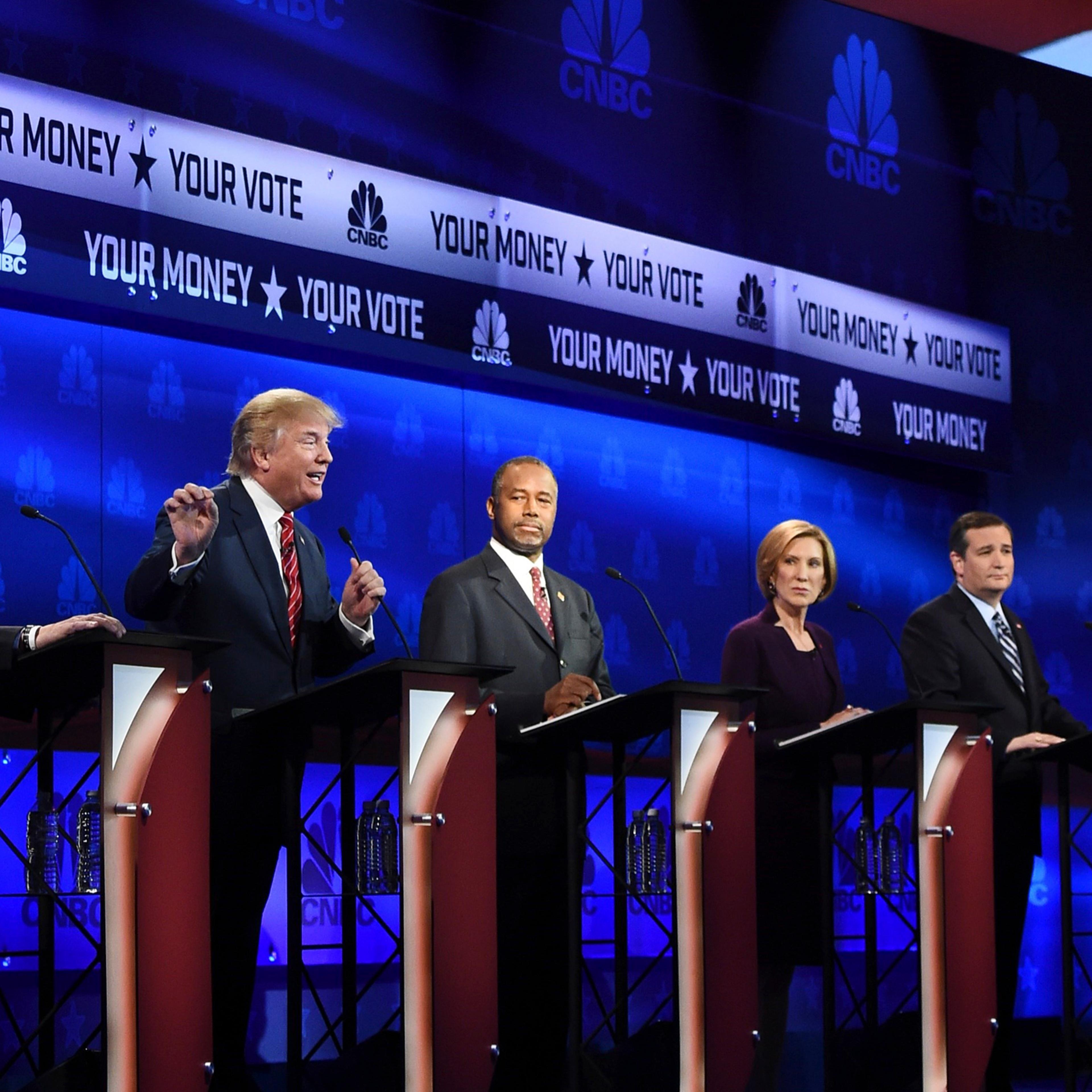 Republican Presidential hopeful Donald Trump (2L) speaks as Marco Rubio (L), Ben Carson (C), Carly Fiorina (2R), and Ted Cruz look on during the CNBC Republican Presidential Debate, October 28, 2015 at the Coors Event Center at the University of Colorado
