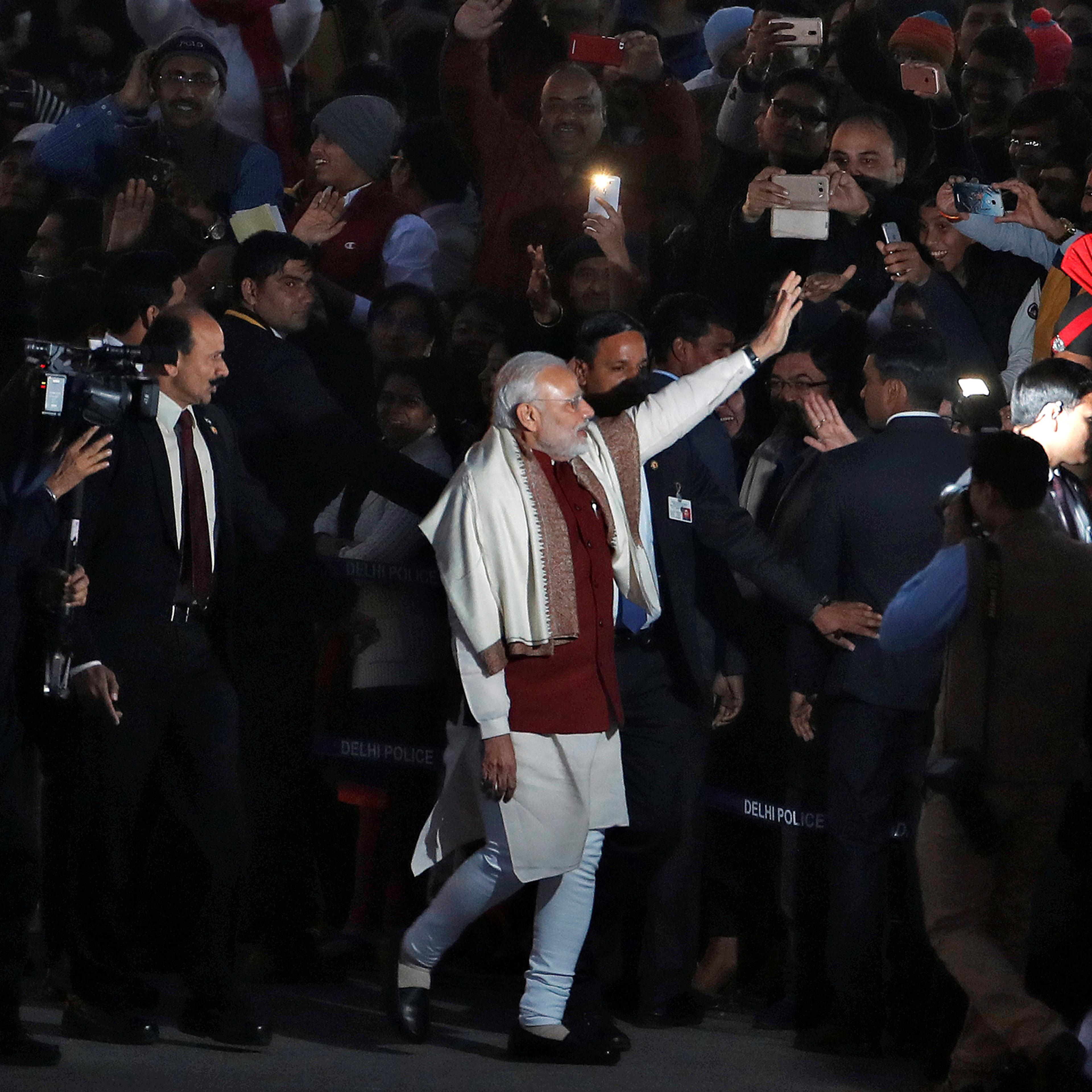 India's Prime Minister Narendra Modi (C) waves as he leaves the Beating the Retreat ceremony in New Delhi, India, January 29, 2017. REUTERS/Cathal McNaughton - RTSXWJW
