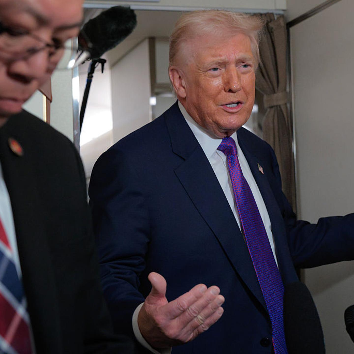 U.S. President Donald Trump talks to reporters on board Air Force One on Feb. 19, 2026.