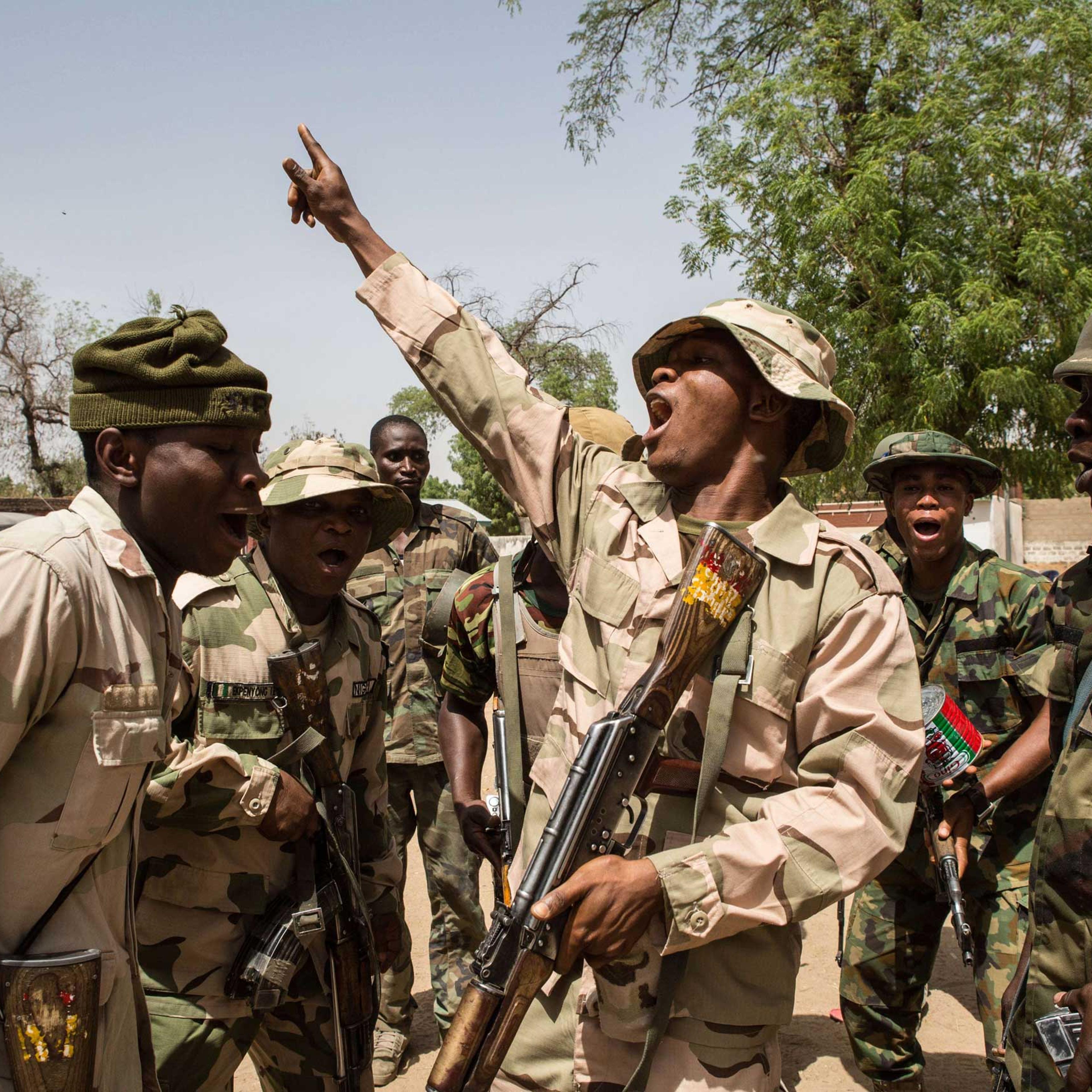 Nigerian troops celebrate after taking over Bama from Boko Haram on March 25, 2015.