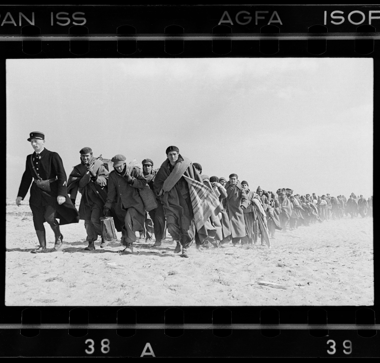 Spanish Republican being led down the beach to a French internment camp, Le Barcarés, France, March 1939