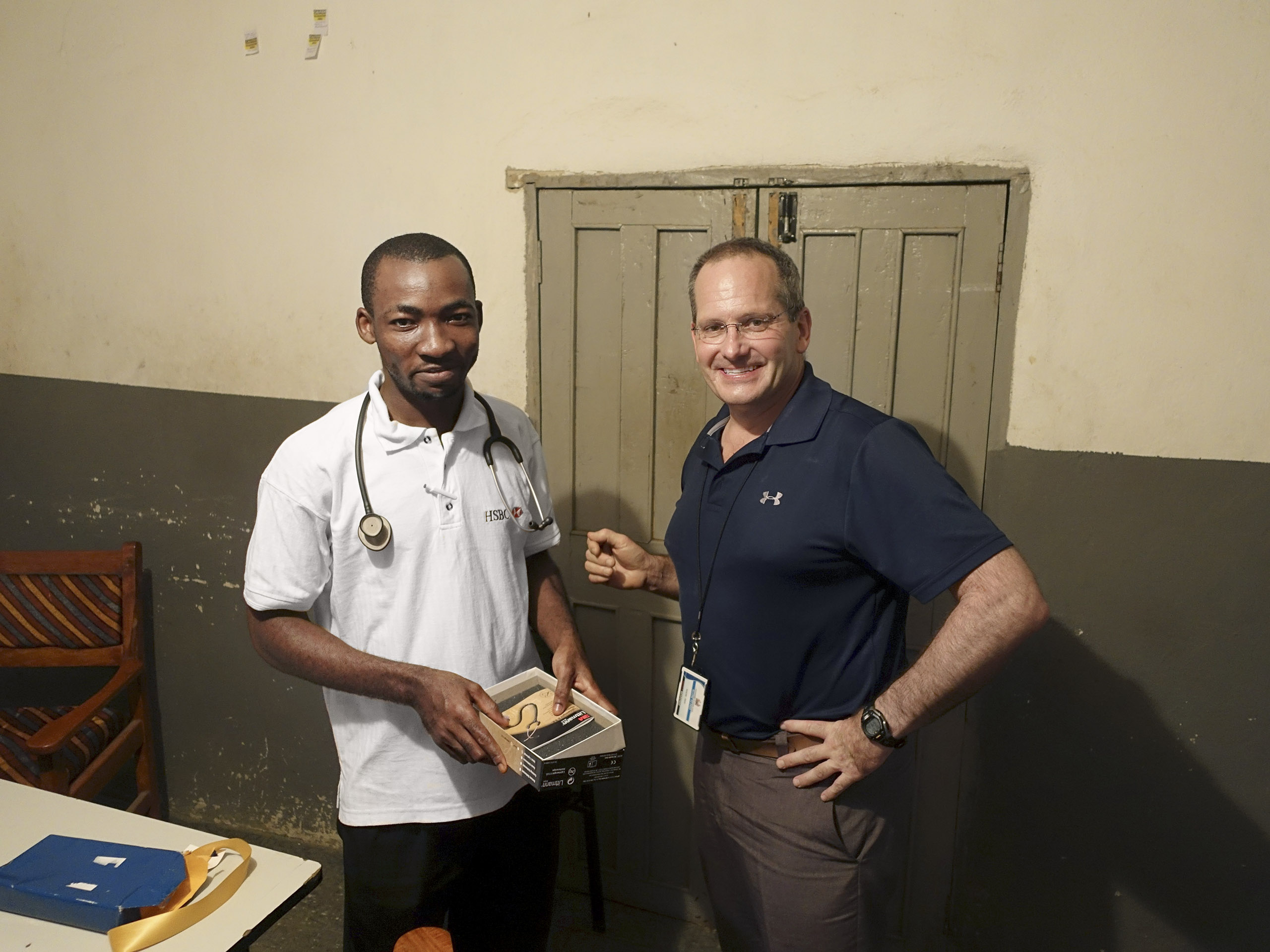Redd, right, with local medical student Francis Abu Bayor.