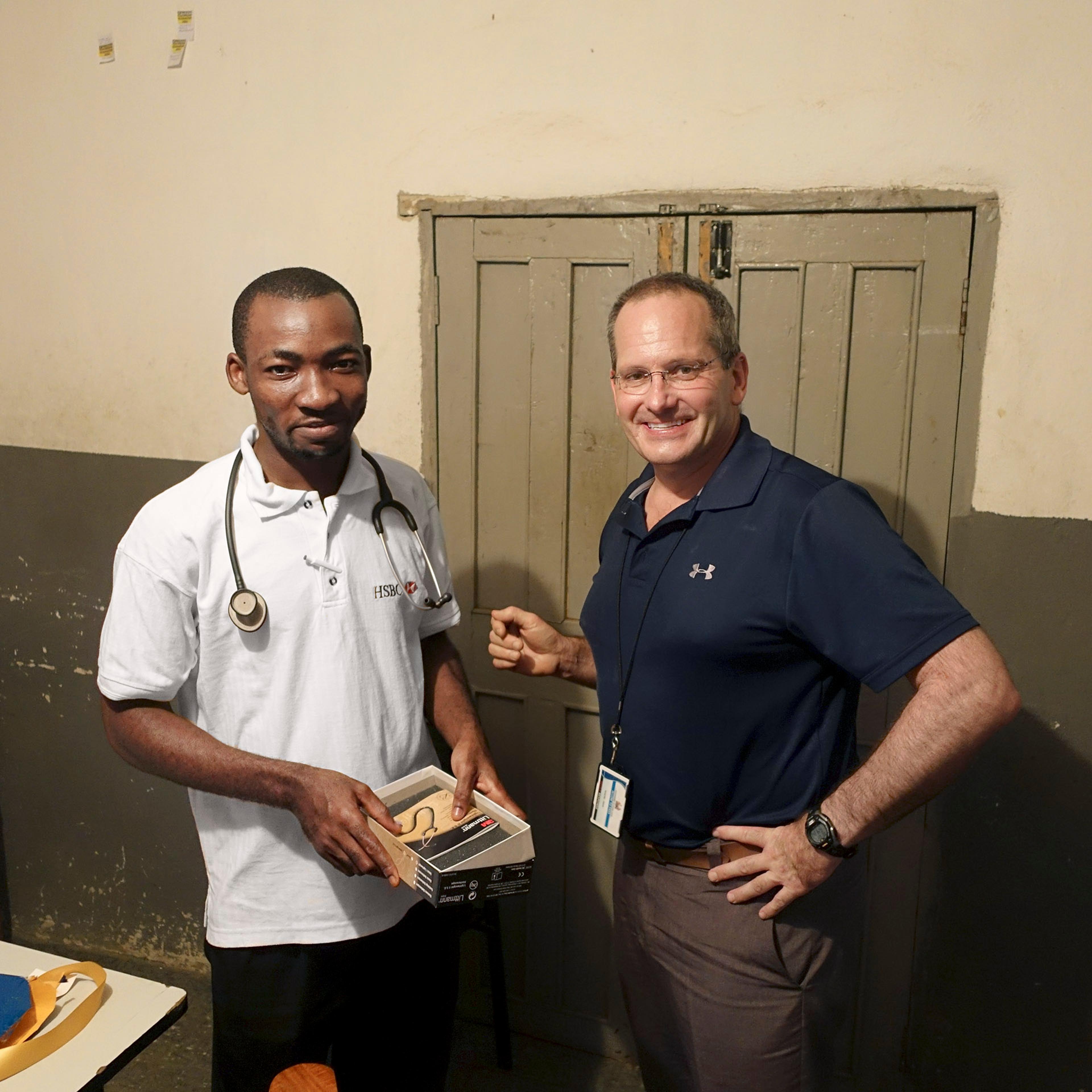 Redd, right, with local medical student Francis Abu Bayor.