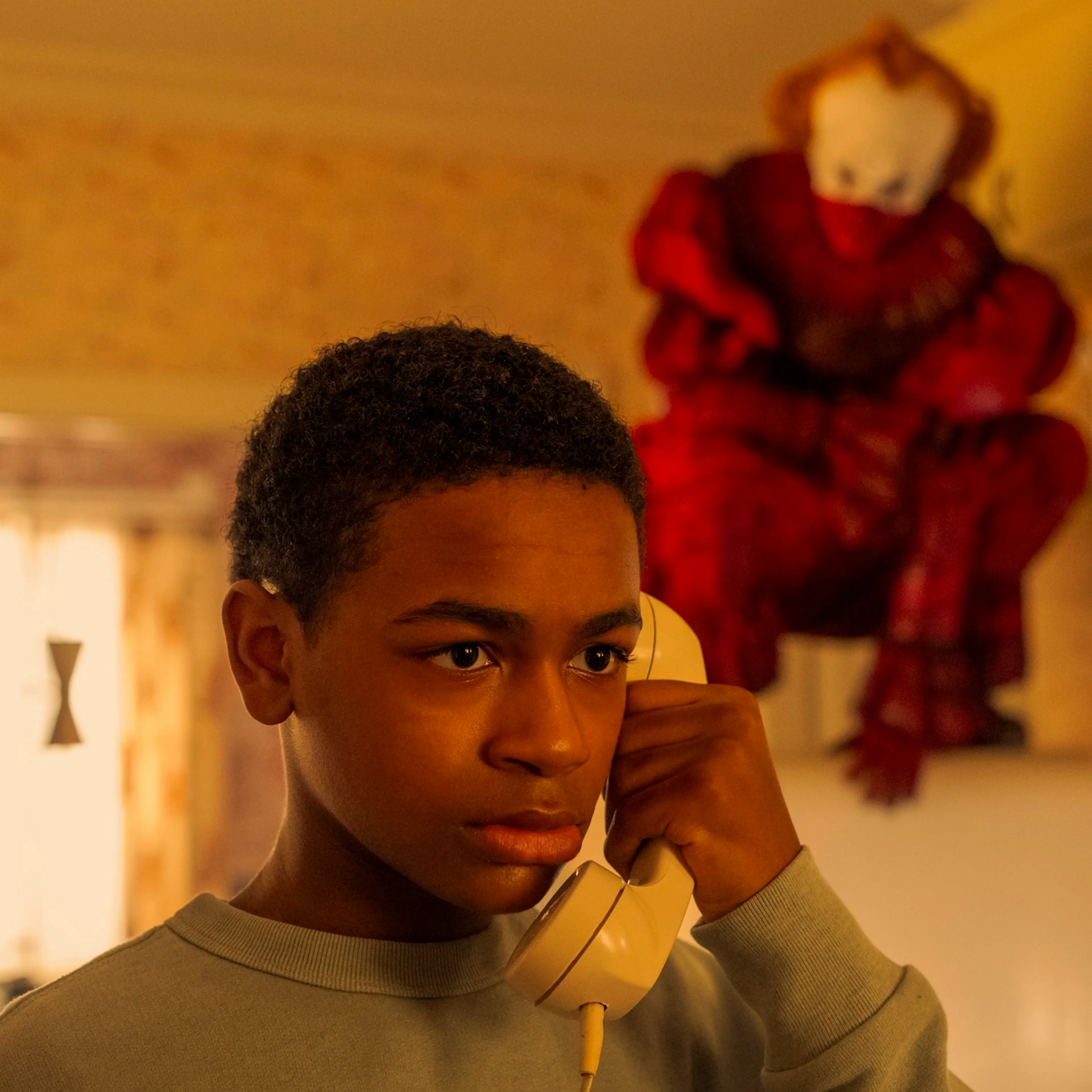 Blake Cameron James as Will and Bill Skarsgard as Pennywise in 'IT: Welcome to Derry.'