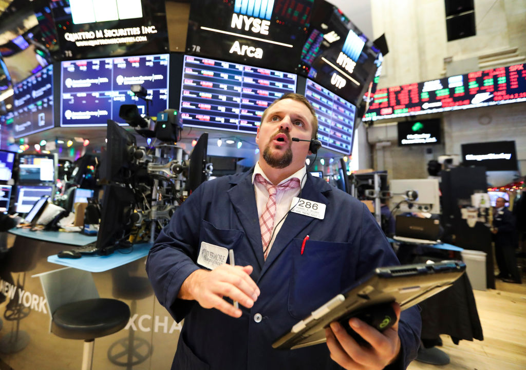 A trader works at the New York Stock Exchange