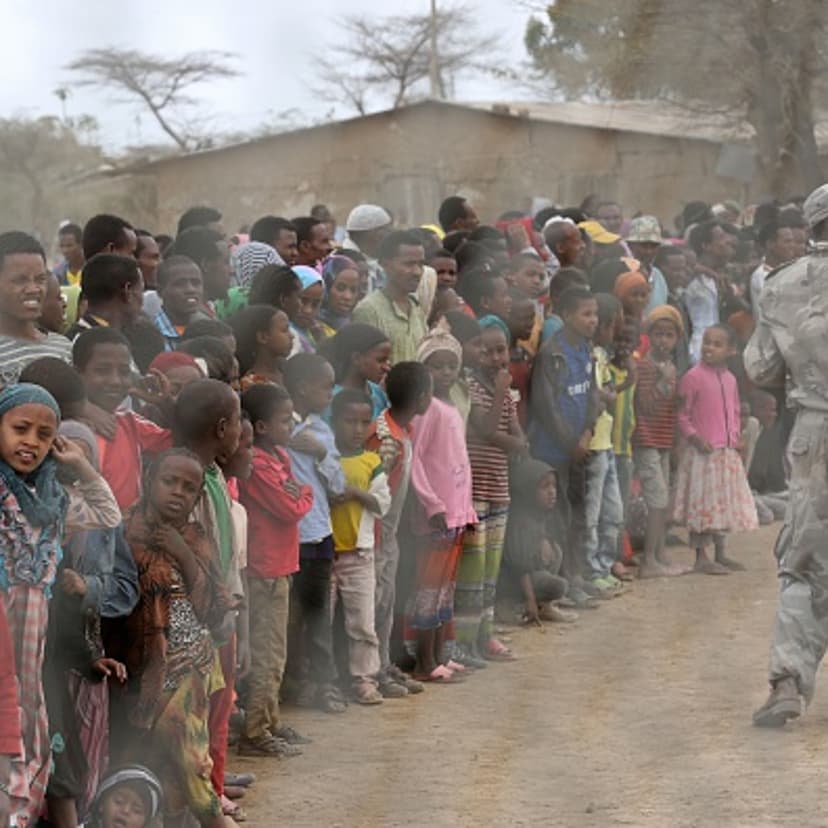 Local residents await the arrival of the UN secretary-general in Ogolcho in Ethiopia's drought affected Oromia region to tour various UN drought relief projects on Jan. 31, 2016.