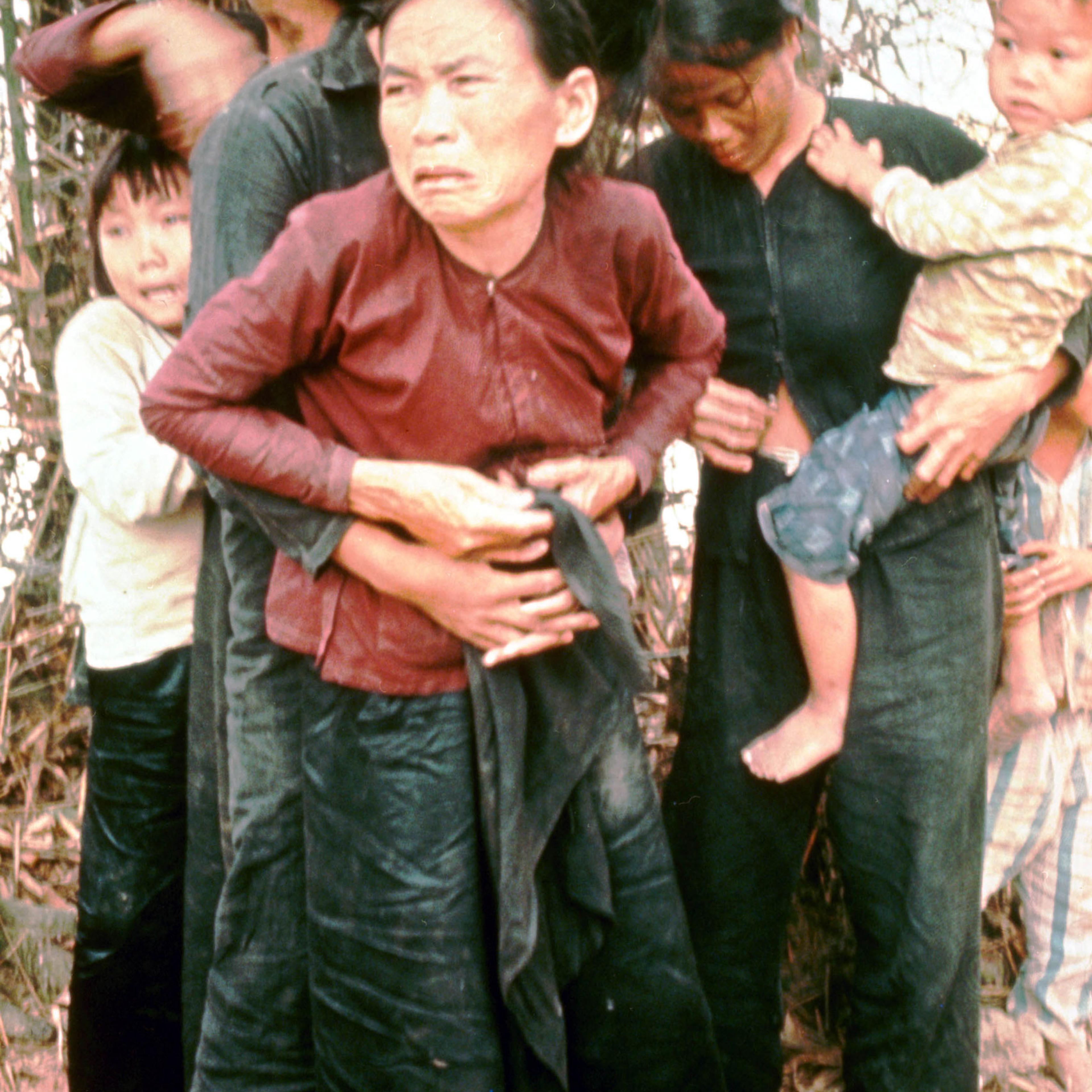 A group of women and children huddle in terror moments before being murdered by American troops in the village of My Lai, Vietnam, March 16, 1968.