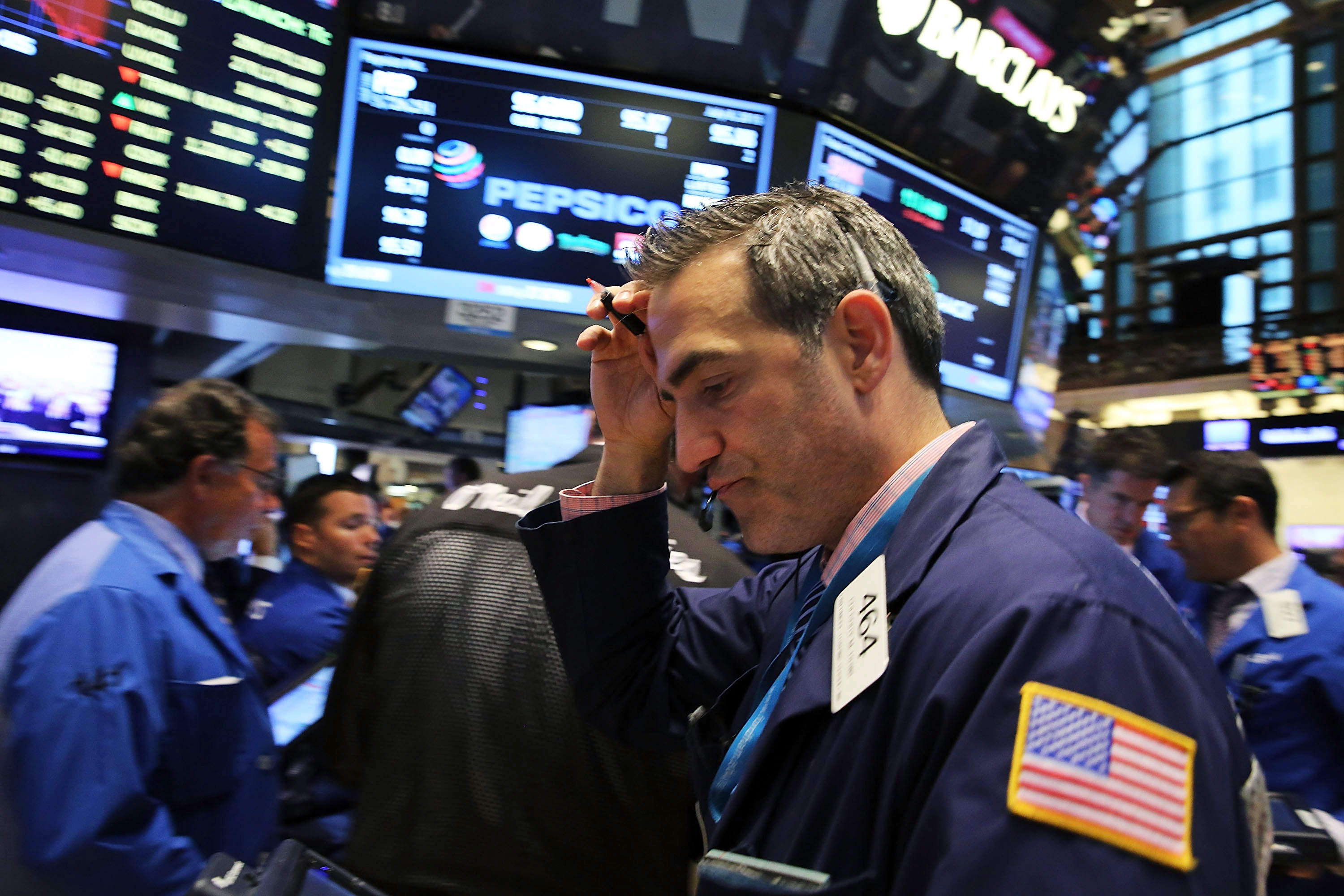 NEW YORK, NY - JULY 08:  Traders work on the floor of the New York Stock Exchange (NYSE) at the close of the day after trading was resumed an over three hour closure of the market due to a "technical glitch" on July 8, 2015 in New York City. Trading was 