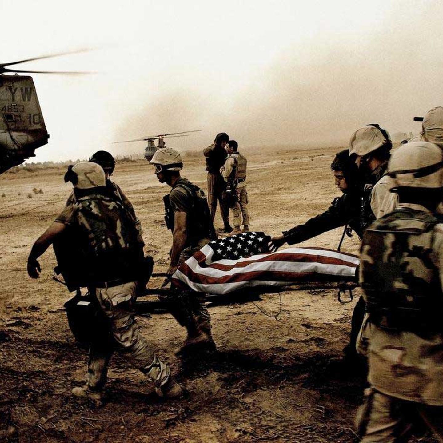 Alex Majoli, April 8, 2003 An American soldier killed during the battle for Baghdad, 10 miles from the city's center.I basically hitch-hiked convoys and helicopters to get to Baghdad before the fall of Saddam. I ended up with this unit of Marines who wer