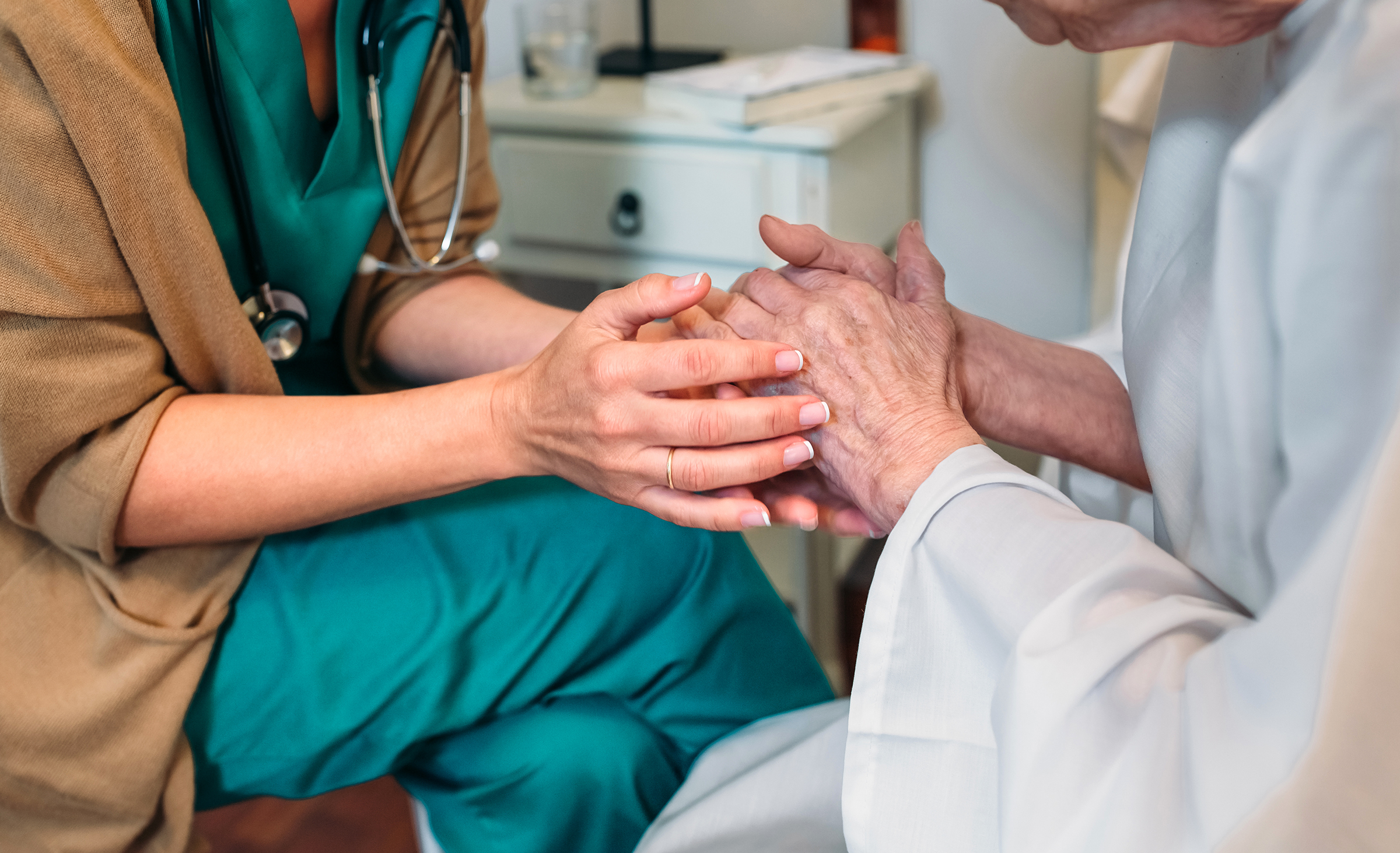 Nurse With Senior Patient In Hospital