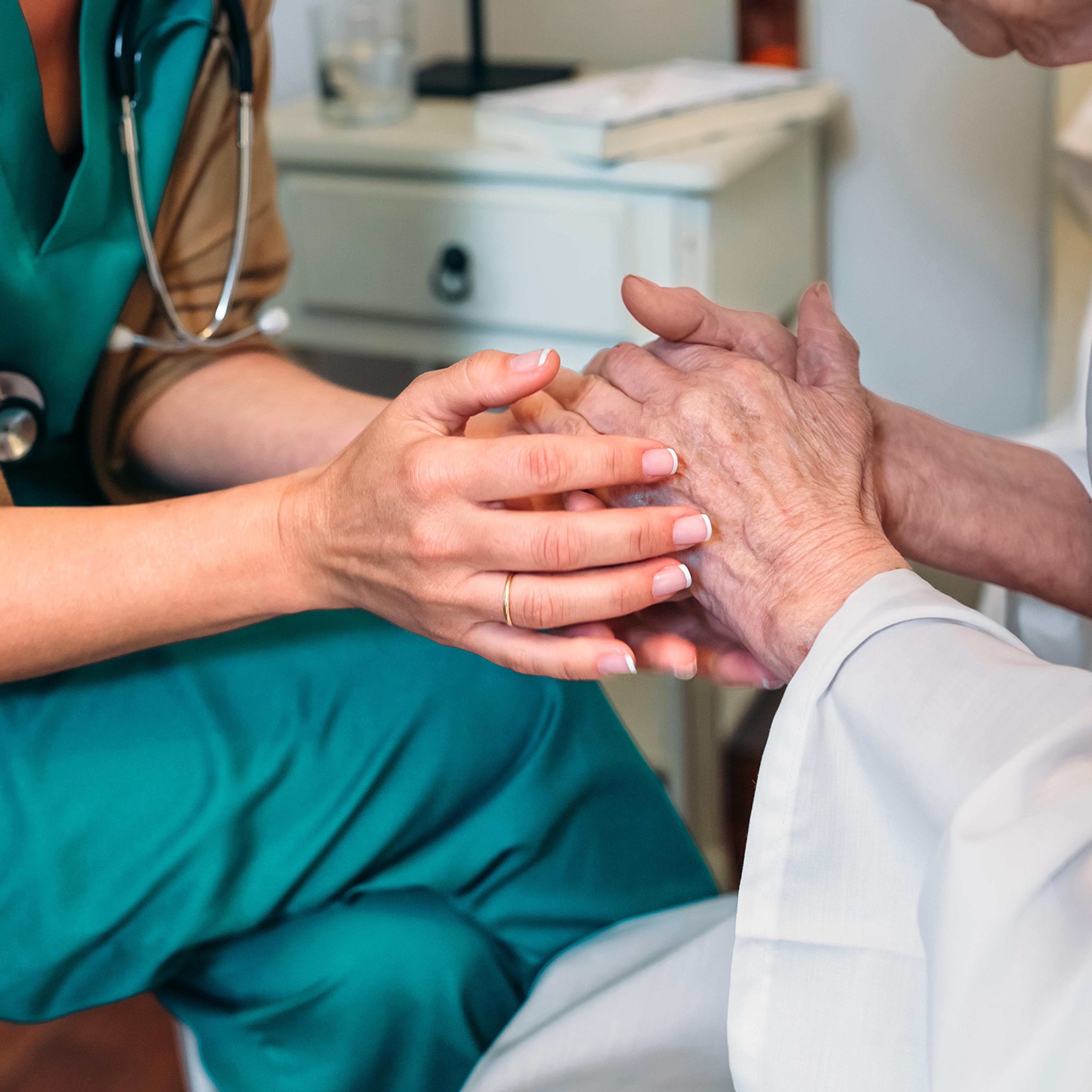 Nurse With Senior Patient In Hospital