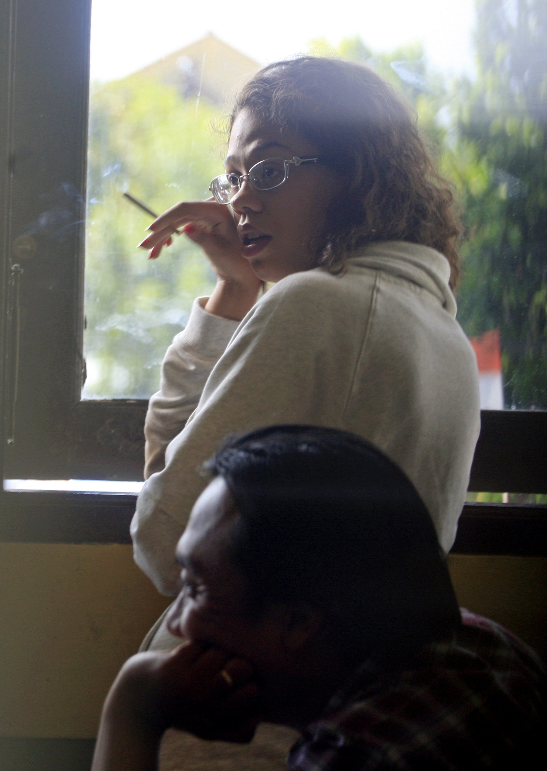 Heather Mack, stands at the police district headquarters after she was brought in for questioning in relation to the death of her mother, in Bali, Indonesia on Aug. 14, 2014.