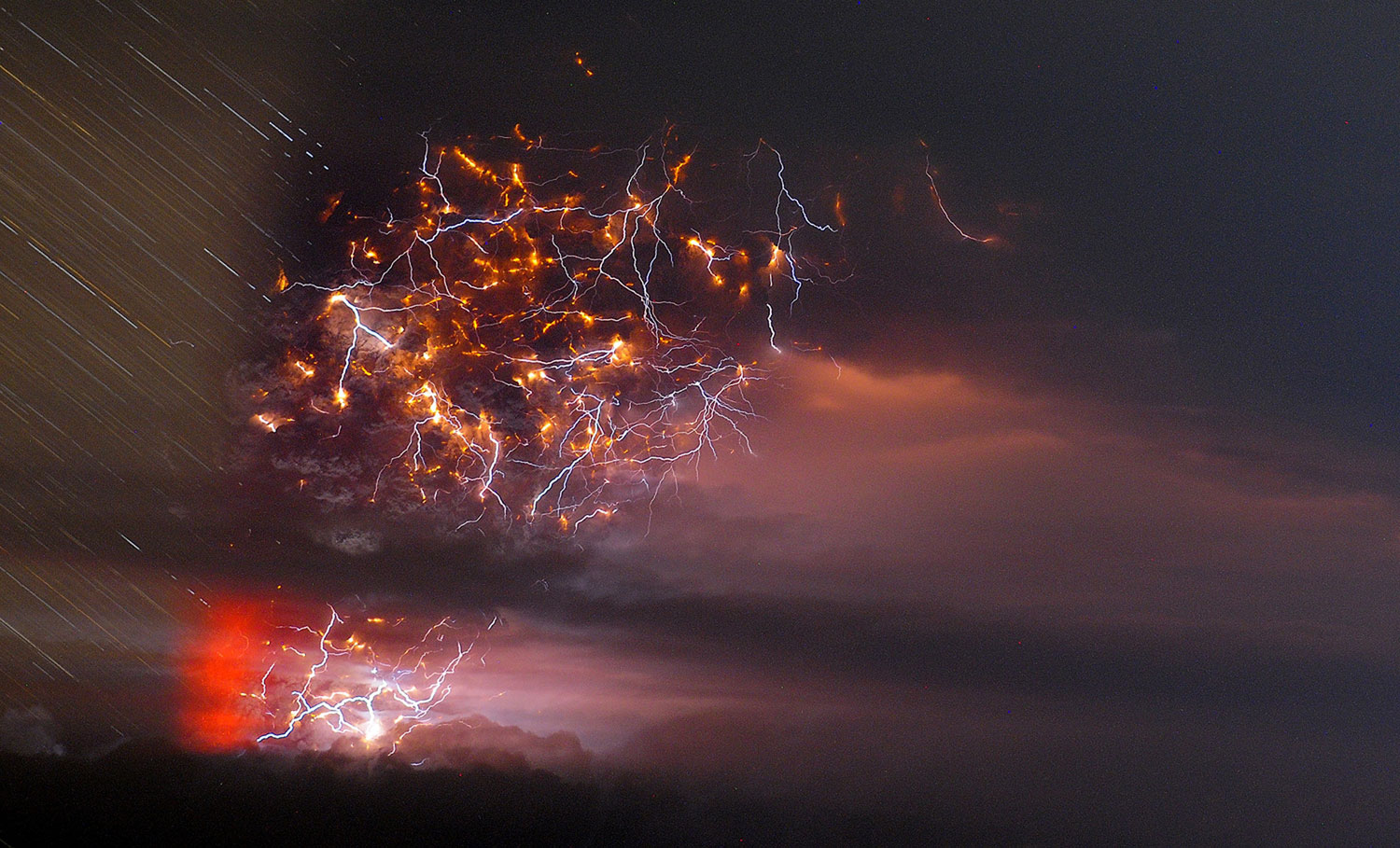 In this time-lapse photo, ash billows from Puyehue volcano as lightning strikes in southern Chile on June 5, 2011.