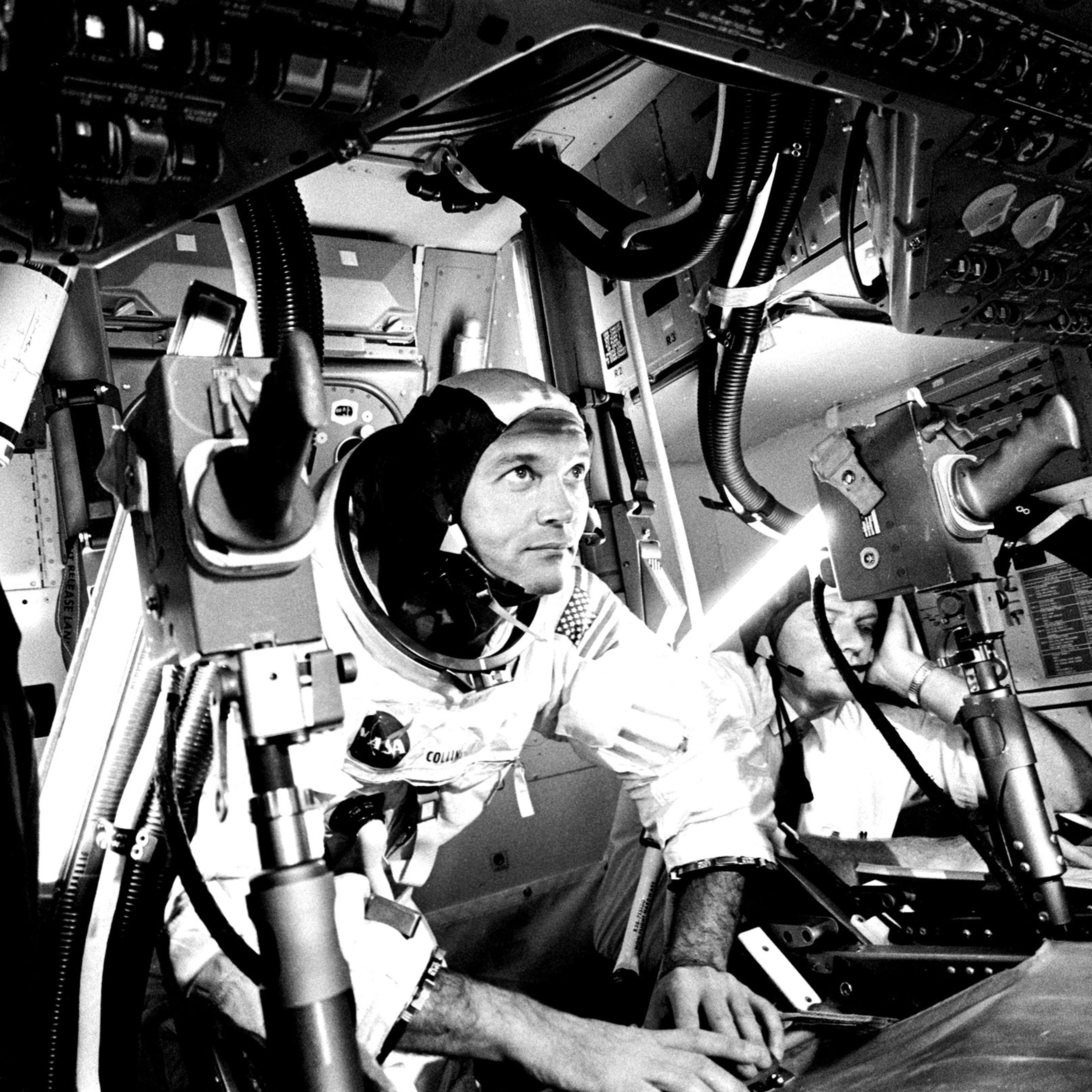 Michael Collins at the Apollo 11 Command Module, practicing docking hatch removal from CM simulator at NASA Johnson Space Center, in Houston on June 28, 1969.