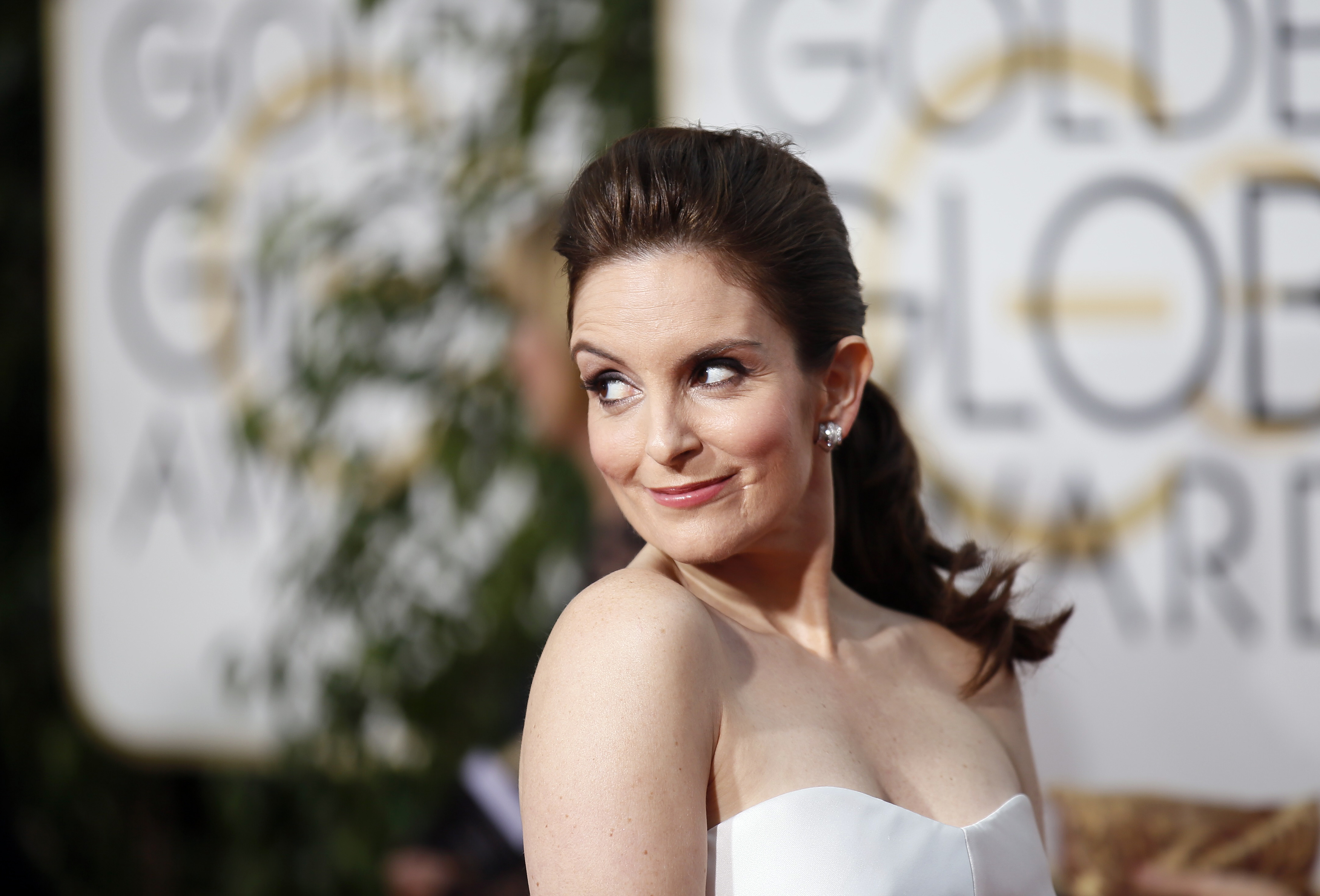 Tina Fey arrives at the 72nd Golden Globe Awards in Beverly Hills