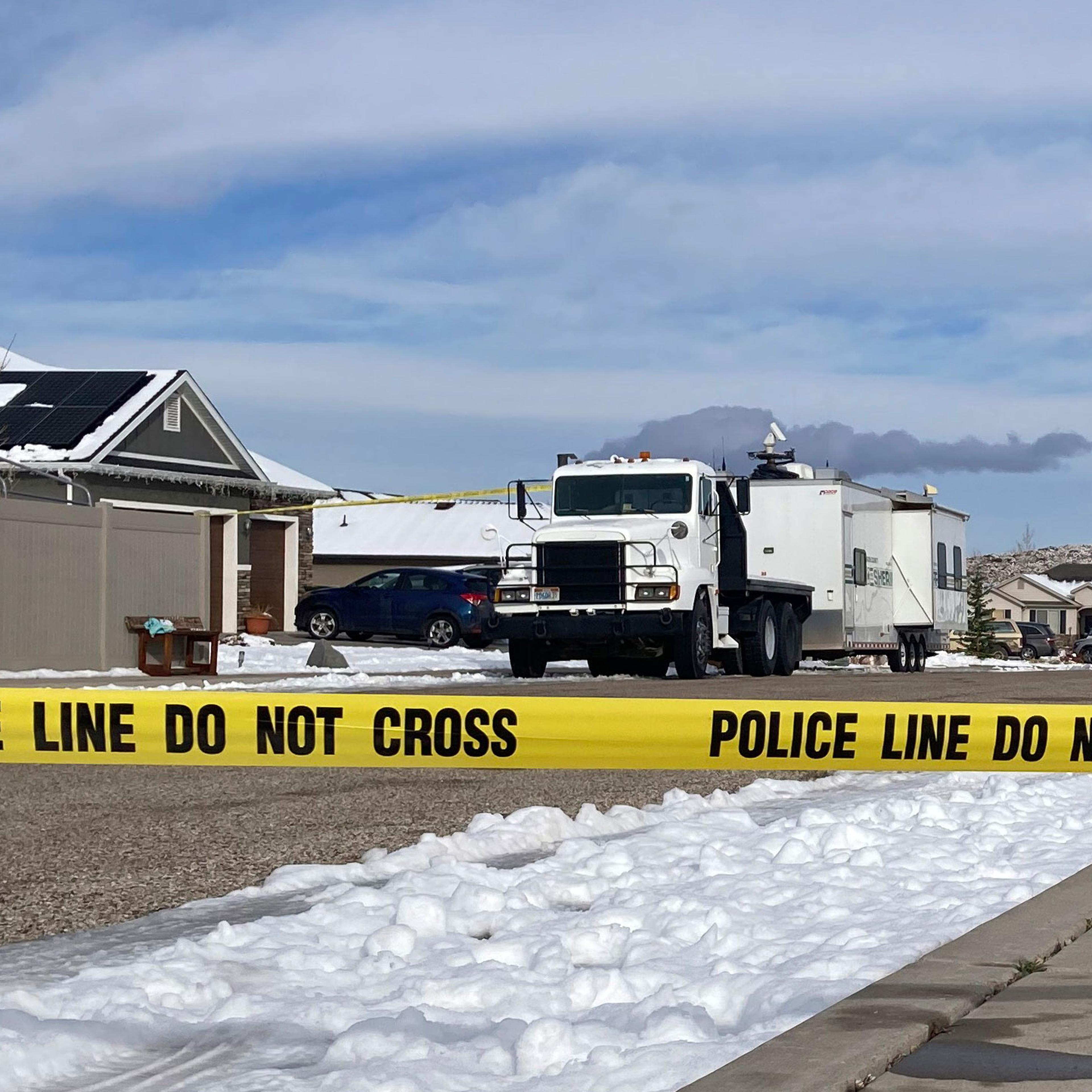 exterior of a home in Utah with police crime tape in the foreground