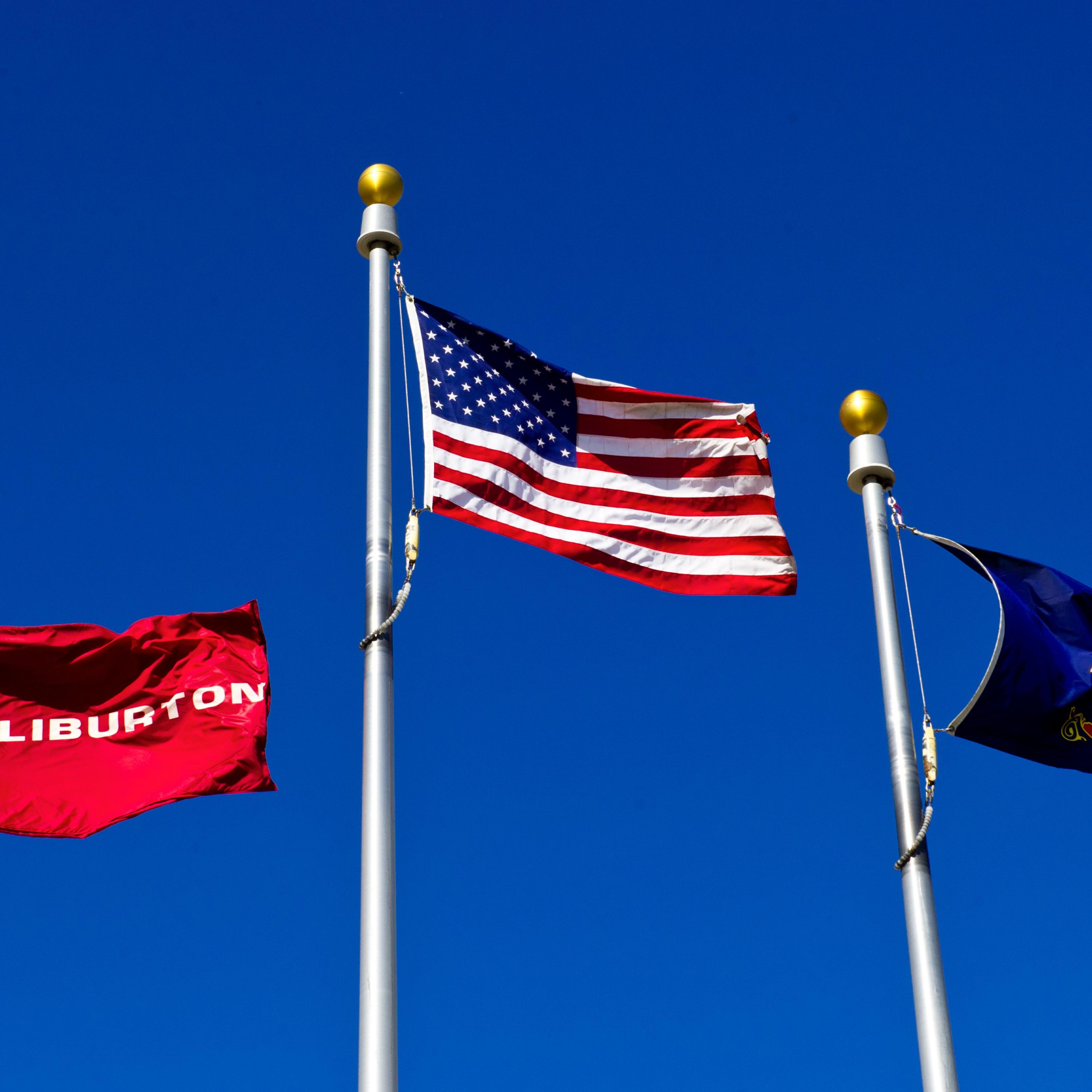 Flags flying at a Halliburton facility in Williston, North Dakota on Aug. 20, 2013.