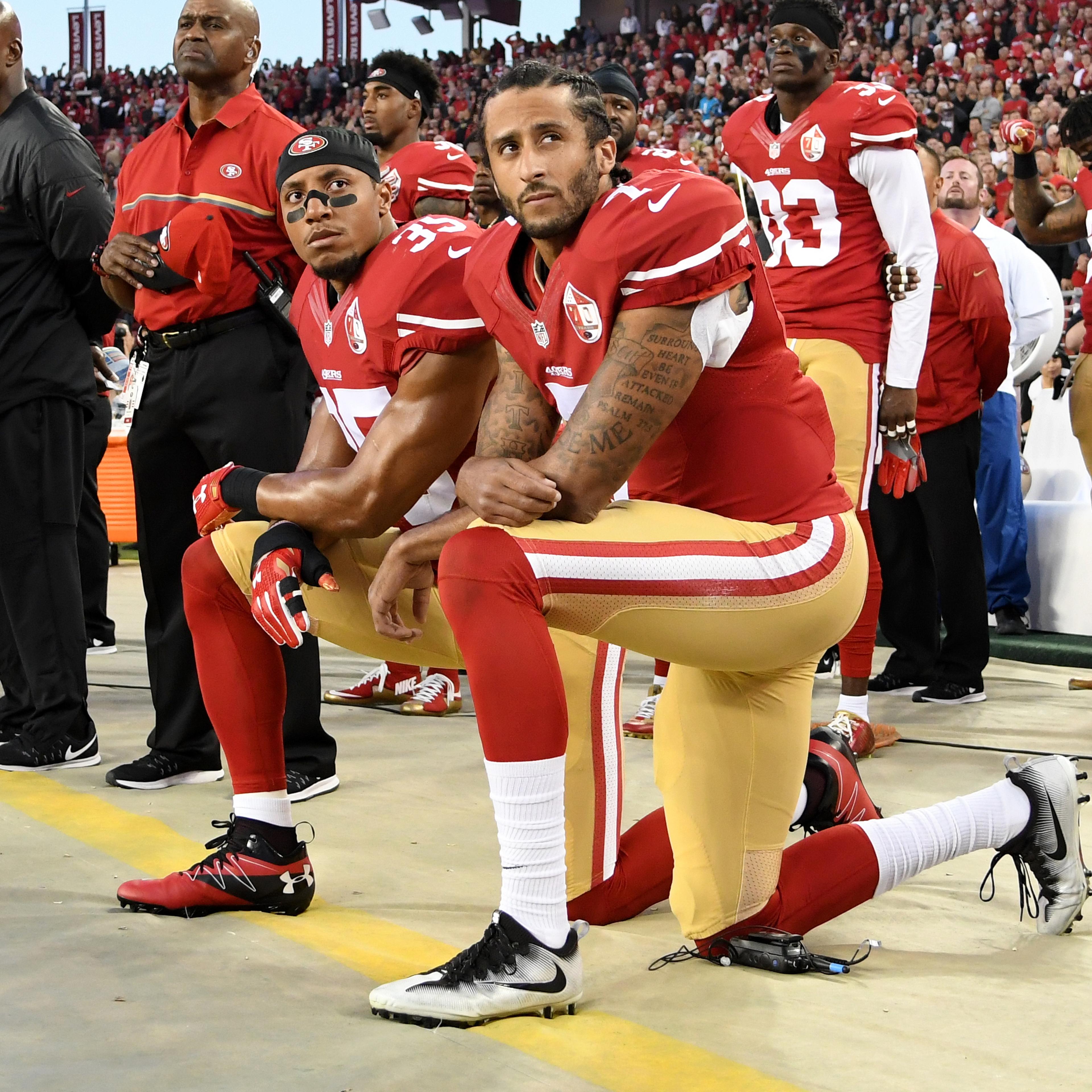 Colin Kaepernick #7 and Eric Reid #35 of the San Francisco 49ers kneel in protest during the national anthem prior to playing the Los Angeles Rams in their NFL game at Levi's Stadium in Santa Clara, Calif., on Sept. 12, 2016.