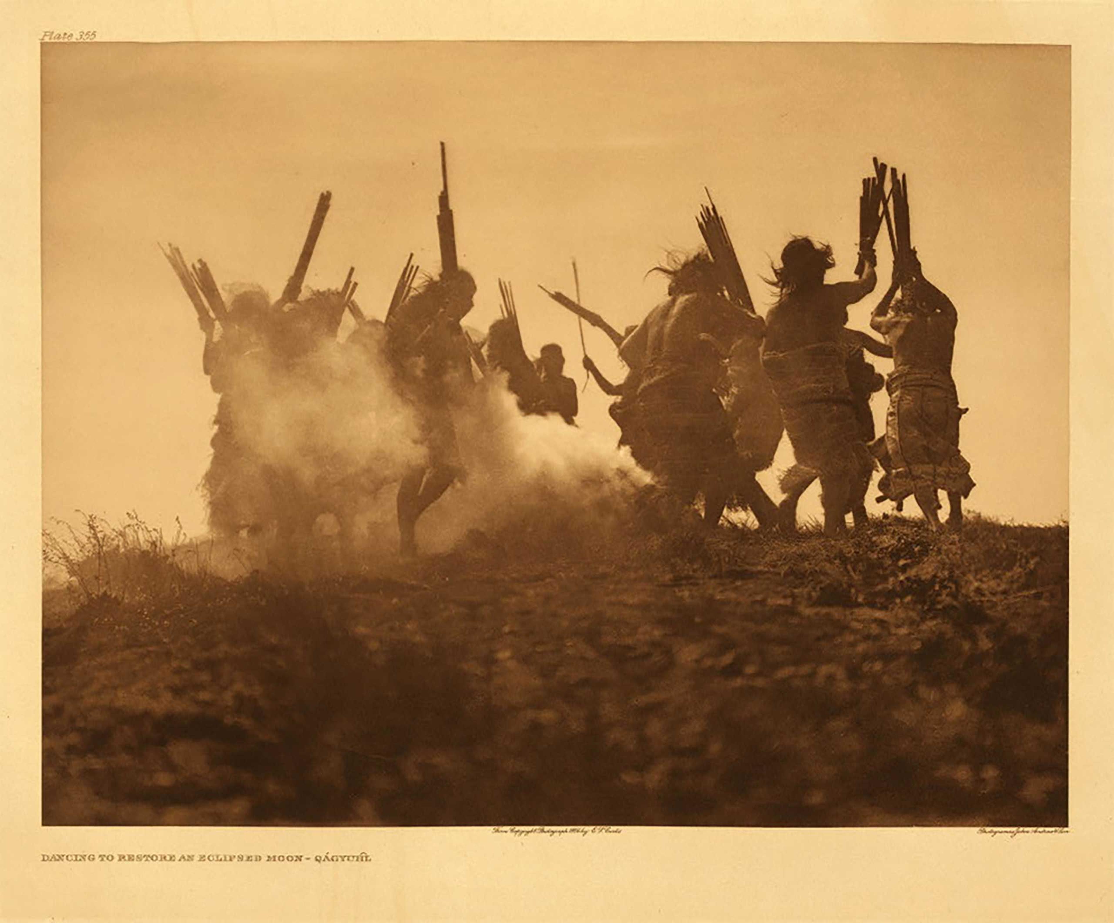 Edward S. Curtis Among the Kwakiutl, Fenimore Art Museum, N.Y.: Oct. 1 - Dec. 31 (Caption: Dancing to restore an eclipsed moon – Qagyuhl, 1914)