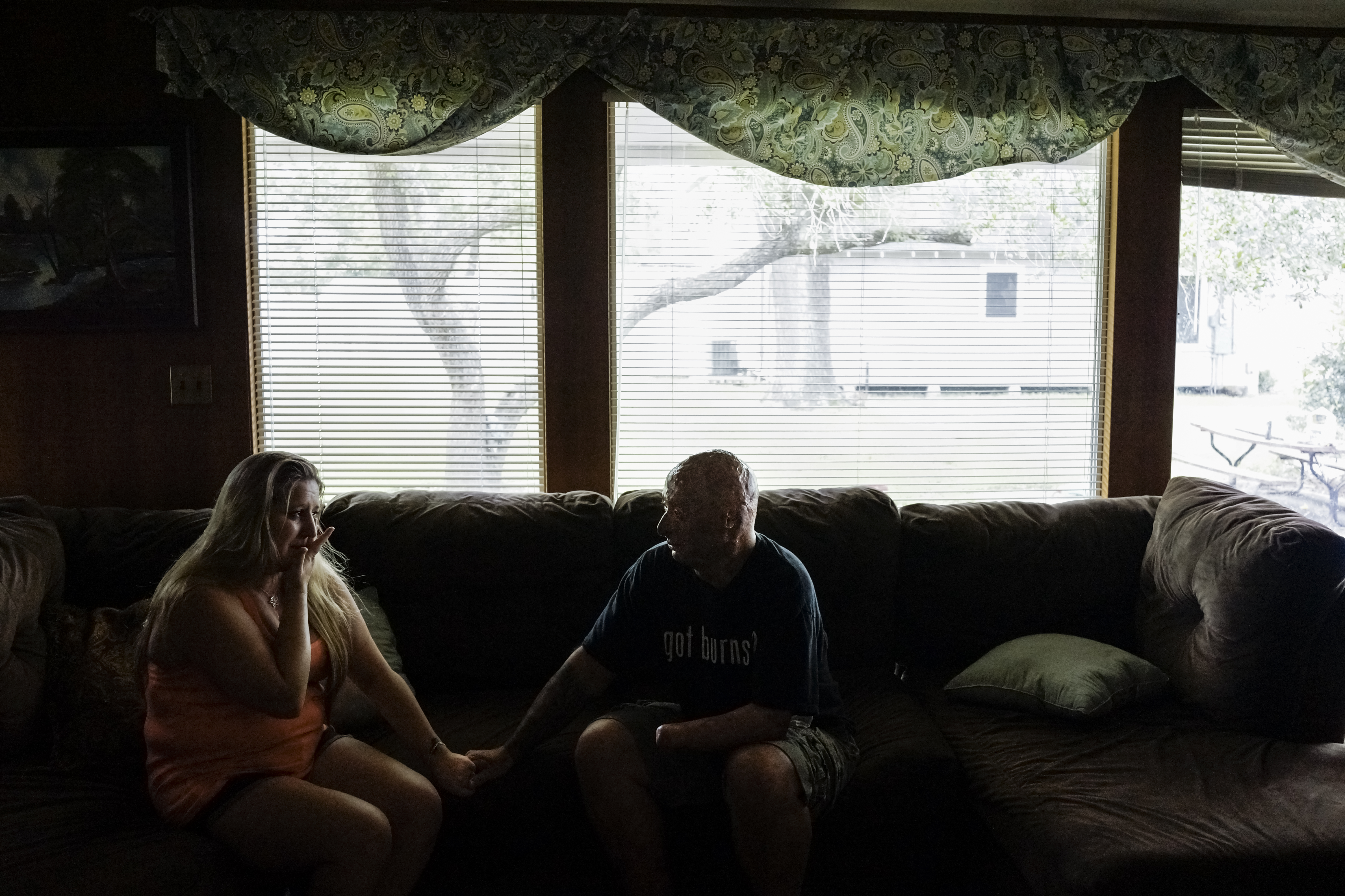 2013. El Campo, TX. USA. Bobby consoles Chastity, the sister of Rodney McCandless. Rodney was killed in the IED explosion that injured Bobby. For years Chastity didn't know that anyone had survived the attack until Bobby was able to reach her by Facebook