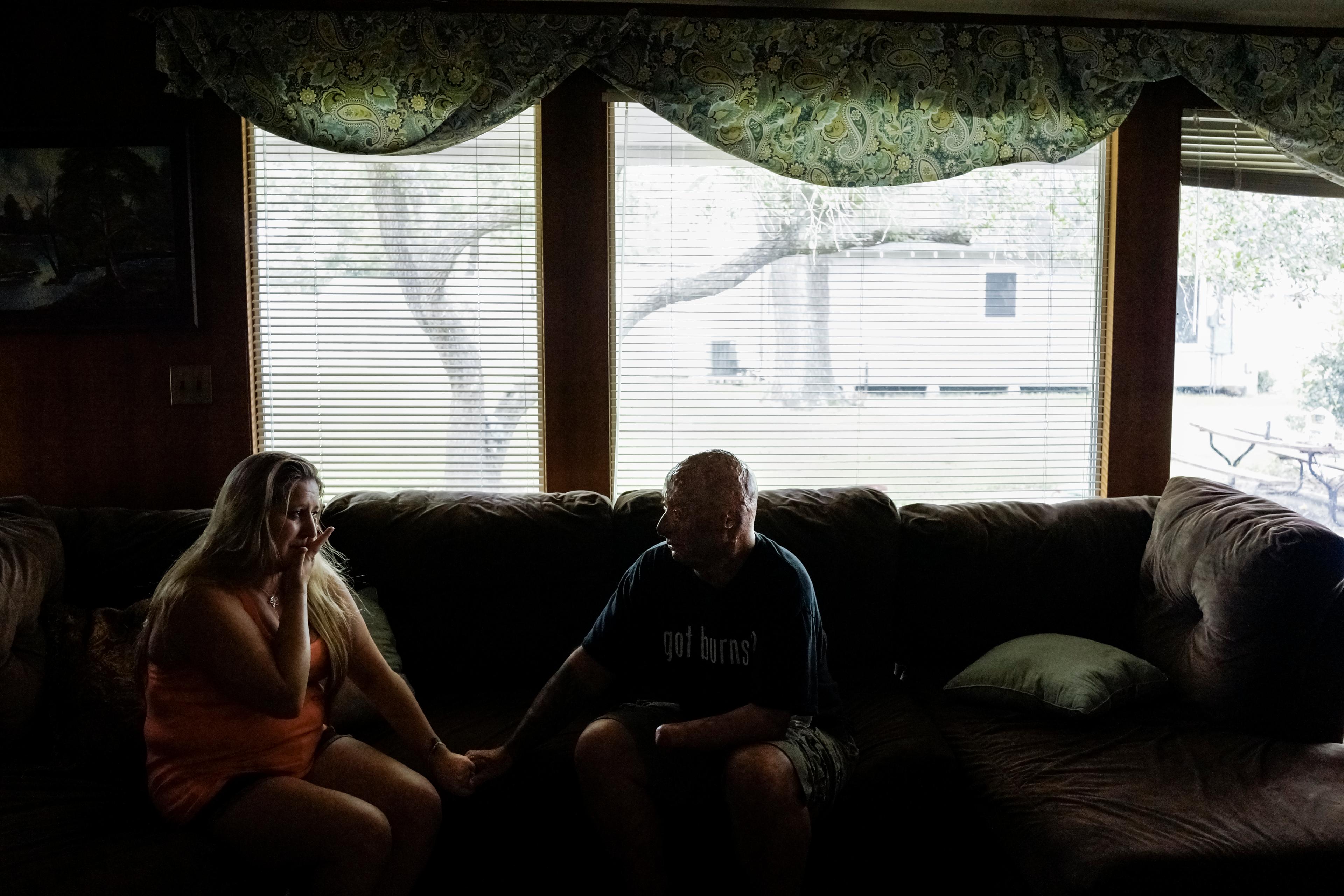 2013. El Campo, TX. USA. Bobby consoles Chastity, the sister of Rodney McCandless. Rodney was killed in the IED explosion that injured Bobby. For years Chastity didn't know that anyone had survived the attack until Bobby was able to reach her by Facebook