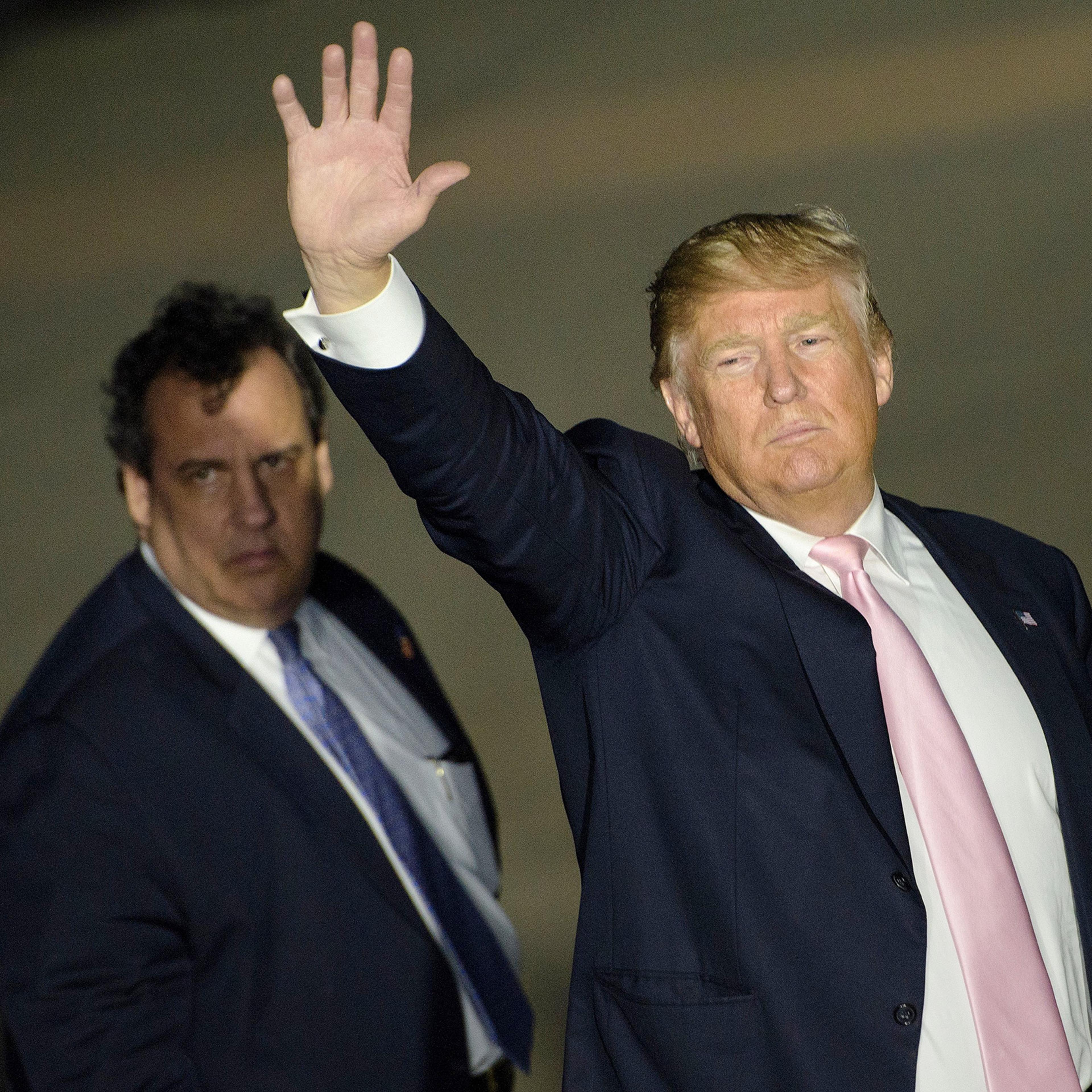 Chris Christie and Donald Trump depart a rally in Vienna Center, Ohio, on March 14, 2016.