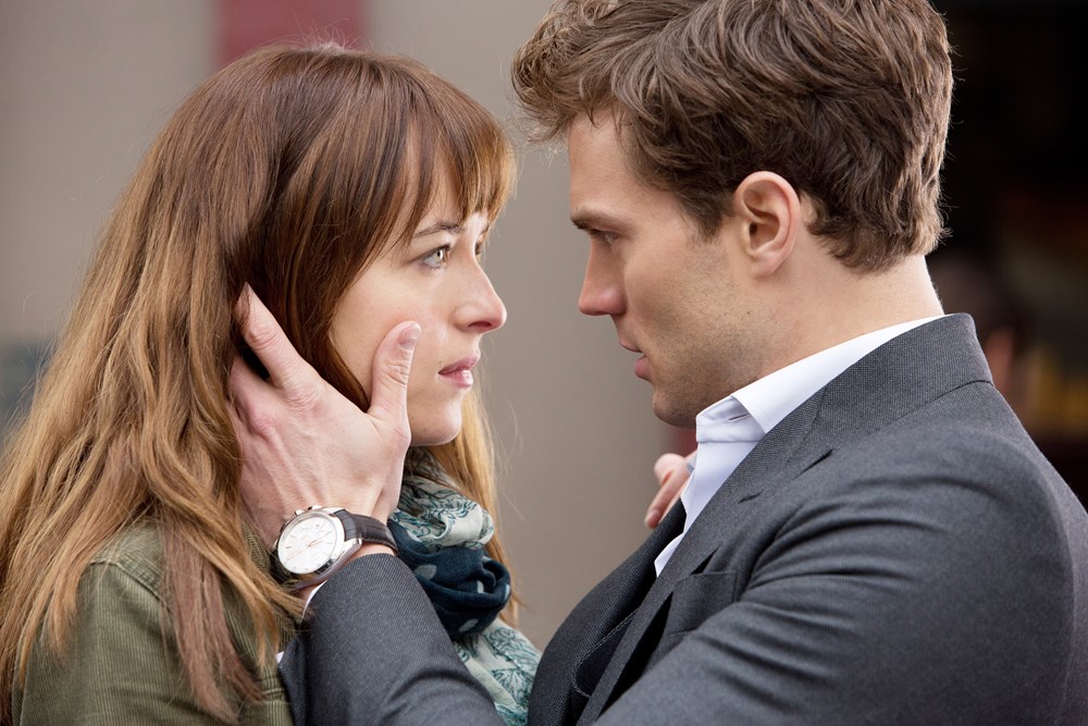 Dakota Johnson (L) and Jamie Dornan (R) in "Fifty Shades of Grey."