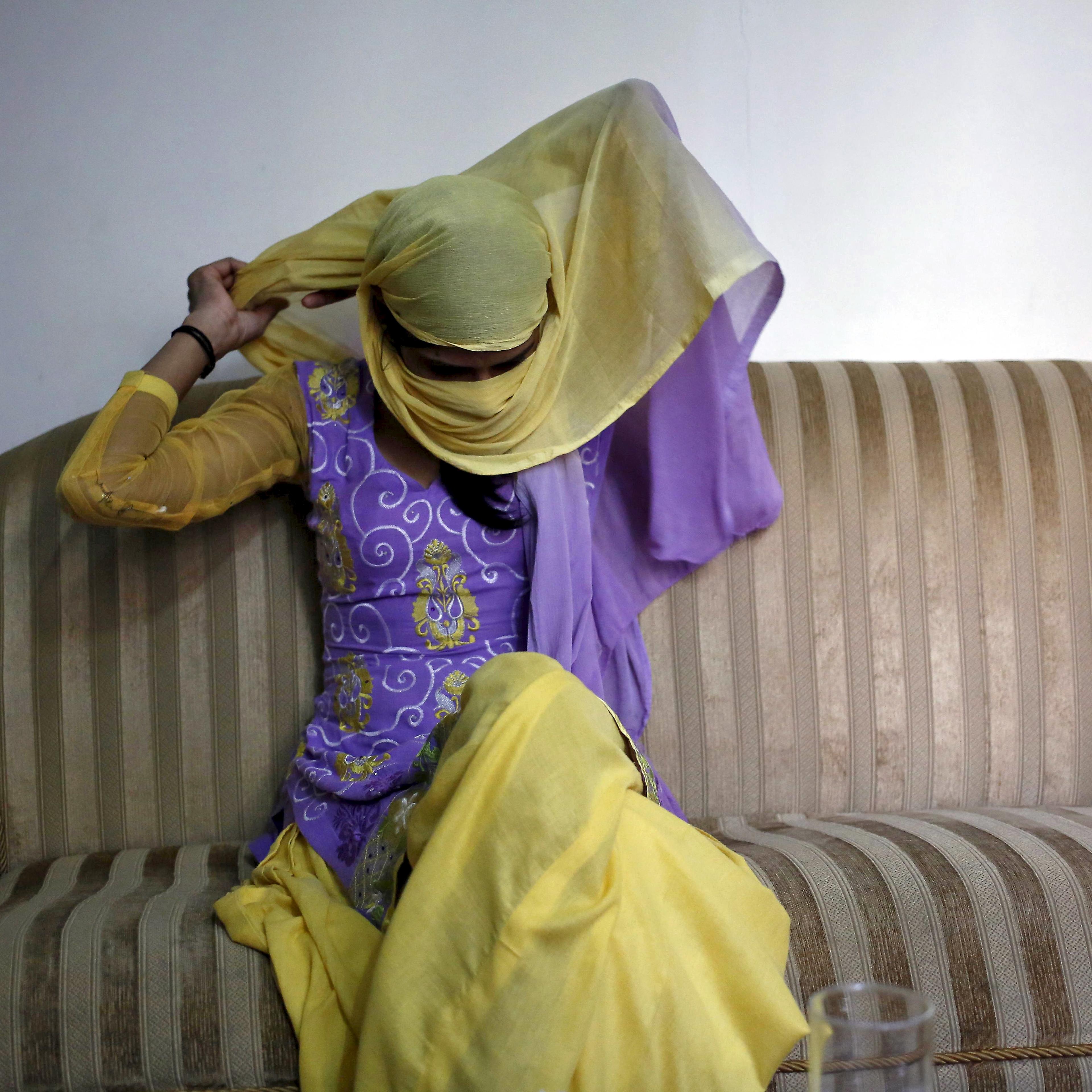 Kumari adjusts her headgear as she sits inside her lawyer's chamber in New Delhi
