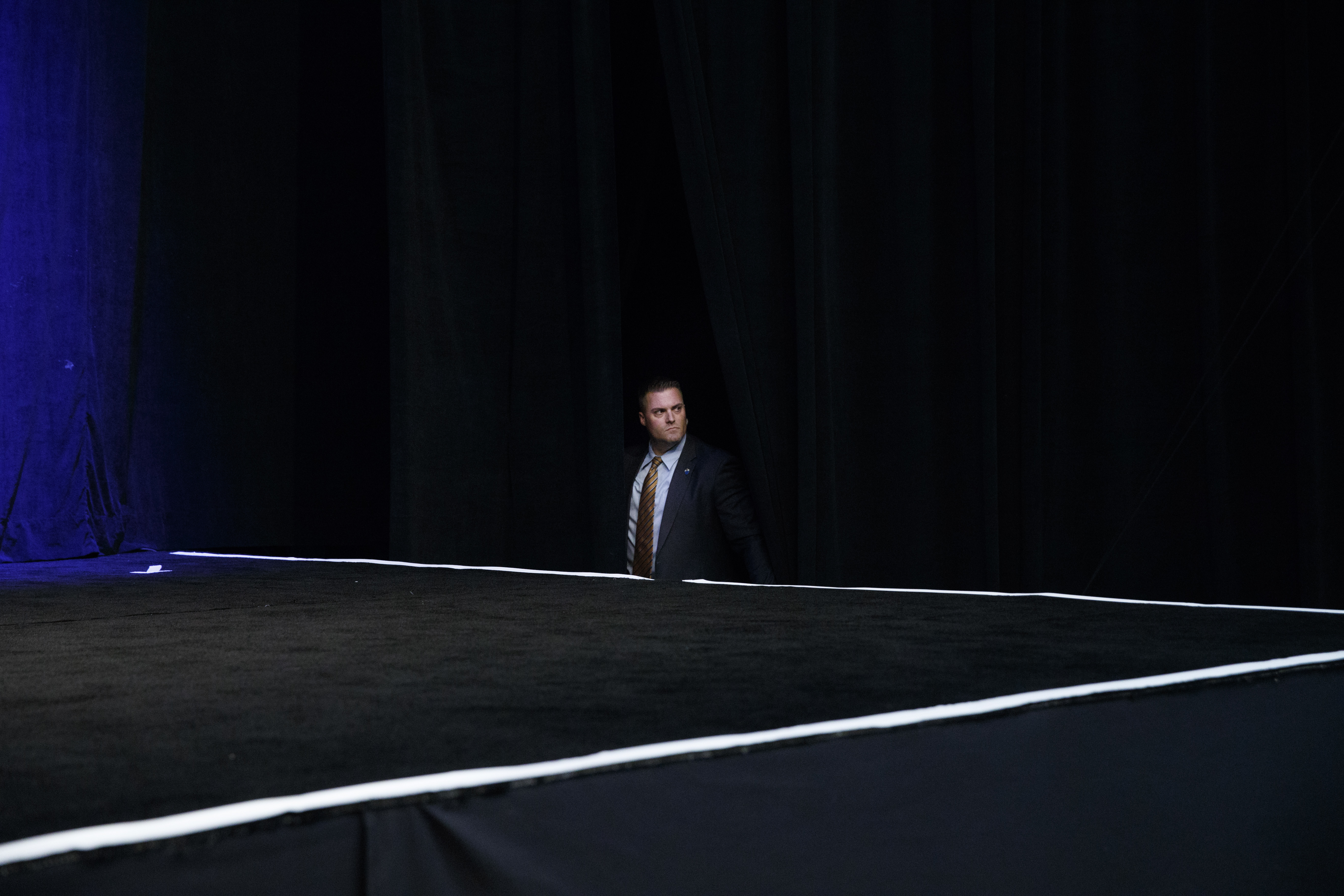 A Secret Service agent waits for the arrival of Republican presidential candidate Donald Trump to a campaign rally, Tuesday, Sept. 13, 2016, in Clive, Iowa.