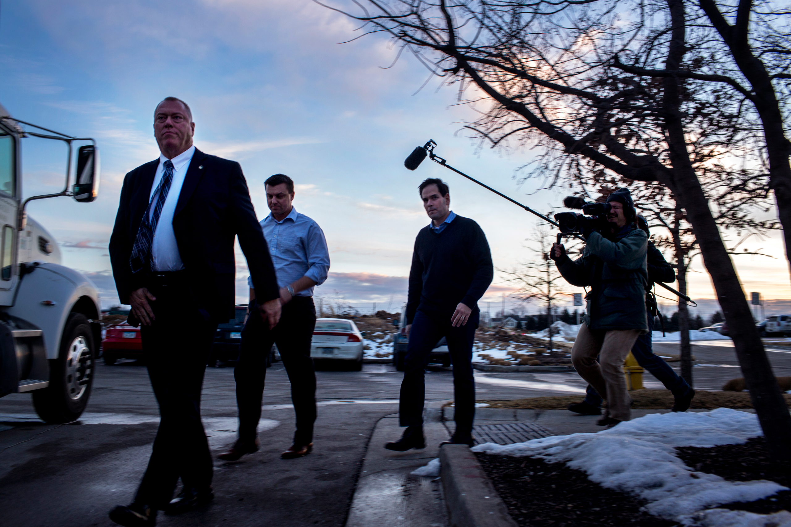 Rubio walks off his bus towards the pub. Marco Rubio spoke to supporters at a campaign rally at the Wellman's Pub and Rooftop in Des Moines Iowa on Wednesday evening, January 27th 2016. (Natalie Keyssar for TIME)