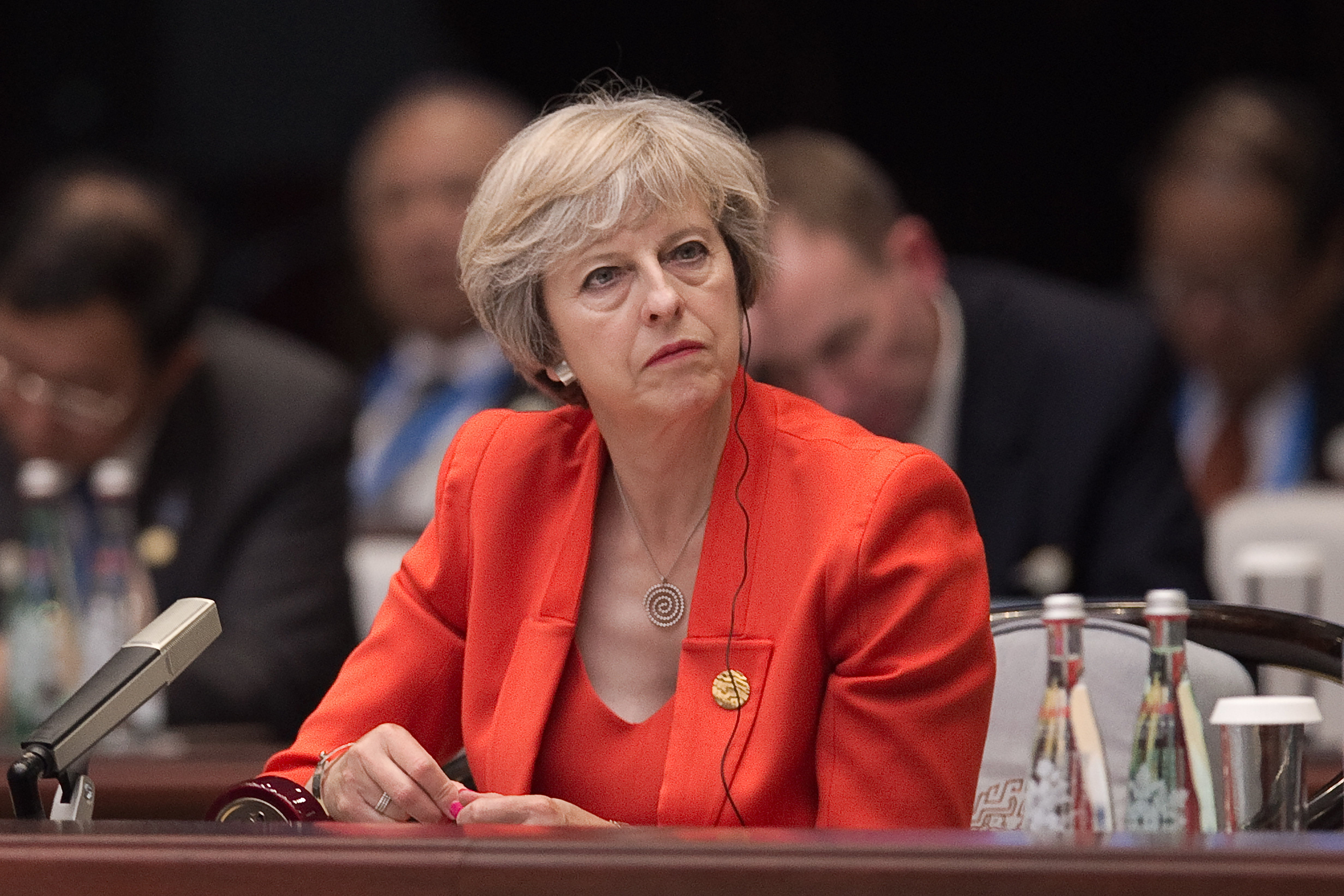 Britain's Prime Minister Theresa May listens to Chinese President Xi Jinping speech during the opening ceremony of the G20 Leaders Summit on September 4, 2016 in Hangzhou, China.